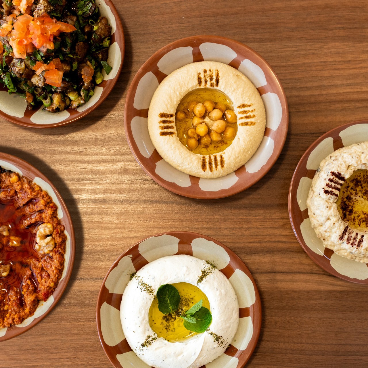 Dive into a world of flavour with our delectable dips! From creamy hummus to spicy Muhammara, these are the stars of our Cold Mezza lineup 🤩 Which one's your favourite? 🍽️✨ #DipIntoFlavor #ColdMezza #FoodAdventure #FlavourfulEats #TasteSensation #ShamiatEats