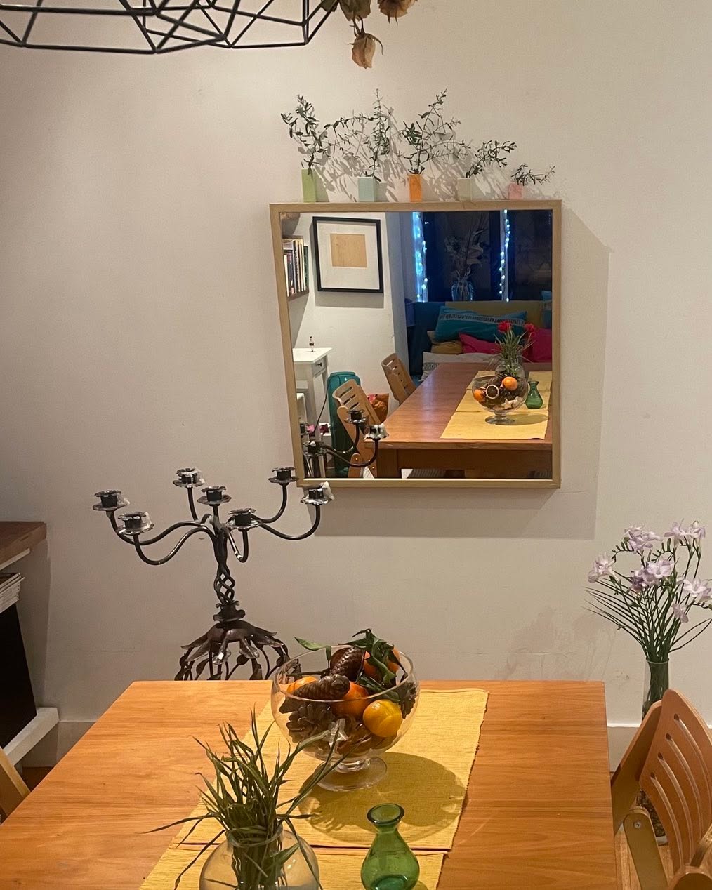 Love a mirror, it tells such a story. Here in my dining room it reflects warm, rich colours, foliage for softness and an abundance of discrete lighting to draw you in and enjoy