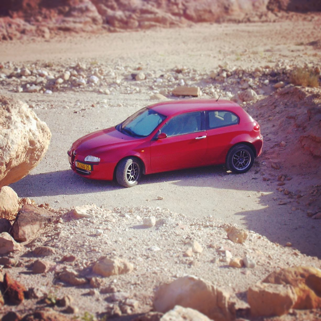 Every car is an off-roader if you take it off road. My Alfa Romeo 147 back in 2004, parked in the middle of Makhtesh HaKatan, the “Small Crater” in the Negev Desert.
.
#alfa147 #alfaromeo #alfaromeo147 #israel #negev #desert #negevdesert #makhteshkatan #makhtesh #crater #smallcrater #lunarlandscape #moon #redcar #italiancar #italiancars #deserttrek #offroad #offroading