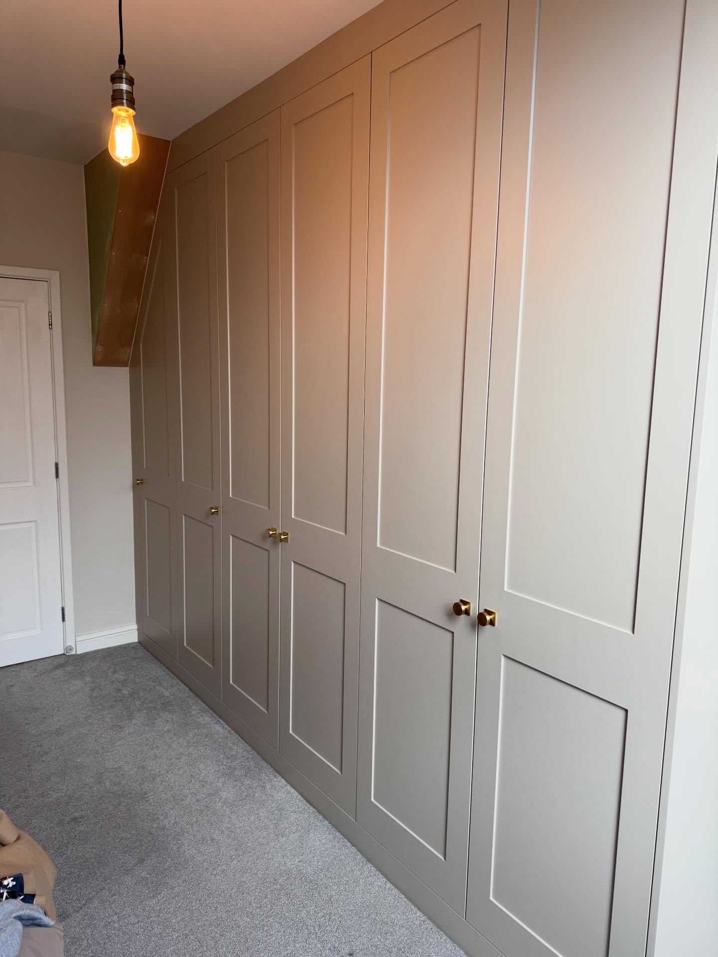 Wardrobe dreams realised. Extra tall shaker doors sprayed @littlegreenepaintcompany Rolling fog 143 complemented by Brushed Brass knobs with square back plates. #bespoke #bedroom #wardrobes #littlegreene #paint