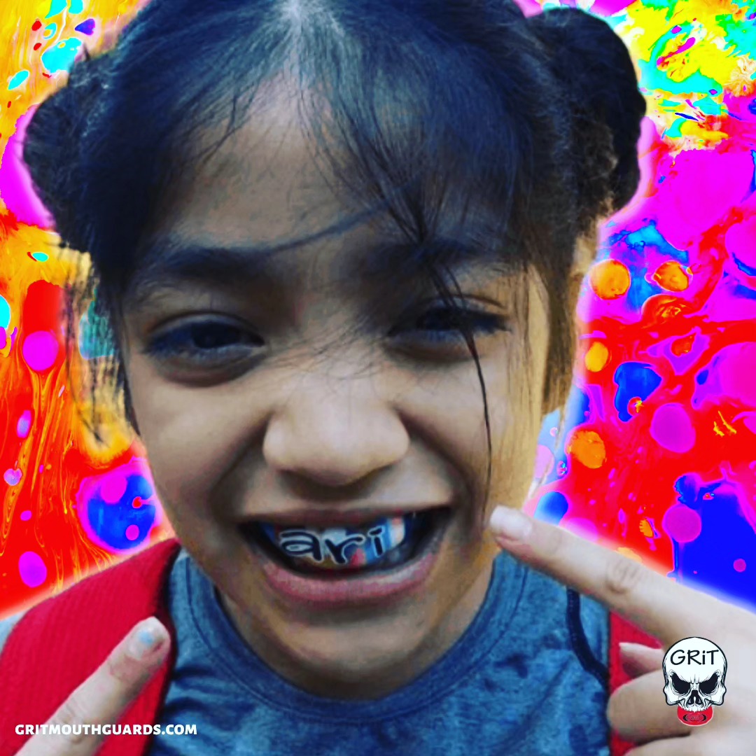 Throwback Thursday with Arianna Hernandez! GRiT mouthguard design is a rainbow camouflage with "Ari" written across the front in a cute black font. #throwbackthursday #tbt #ari #gritmouthguards #mouthguards