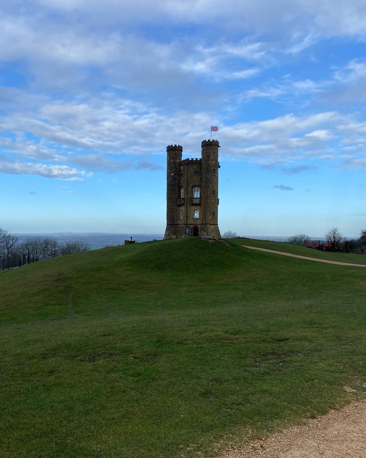 Another tower on a lonely hillside, another call to adventure.
The Broadway Tower sits on the edge of The Cotswolds’ escarpment, where the land drops away and beyond the Vale of Evesham stretches all the way to Wales’ and England’s land border. The view from the top is impressive but the tower itself is meant to stir thoughts of castles and far off times.
Here at the end of the year let’s remember the past that this Folly was built to evoke but also look ahead to adventures yet to come in the new year.
•
•
•
Hello. I’m William Harry Mitchell, a Blue Badge Tourist Guide and Historical Interpreter. I lead tours around London and all over England. Want a tour? Have a look at my website (link in bio) for some ideas and get in touch through the contact form. @whmtours
#broadwaytower #cotswolds #history #adventure #calltoadventure #pathway #lonely #sky #outside #end #newyear #england #tour #tourguide #touristguide #tower #bluebadgeguide