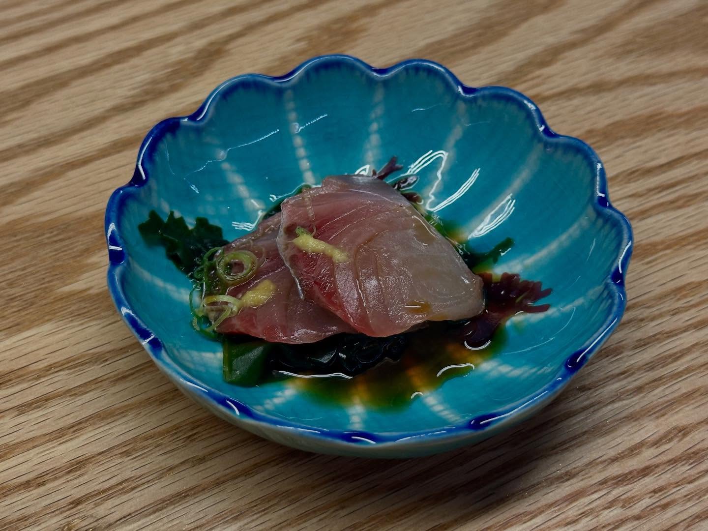Finished with a gently tangy sauce and scallions for a bright, clean bite that wakes up the palate. Simple, precise, unforgettable.
