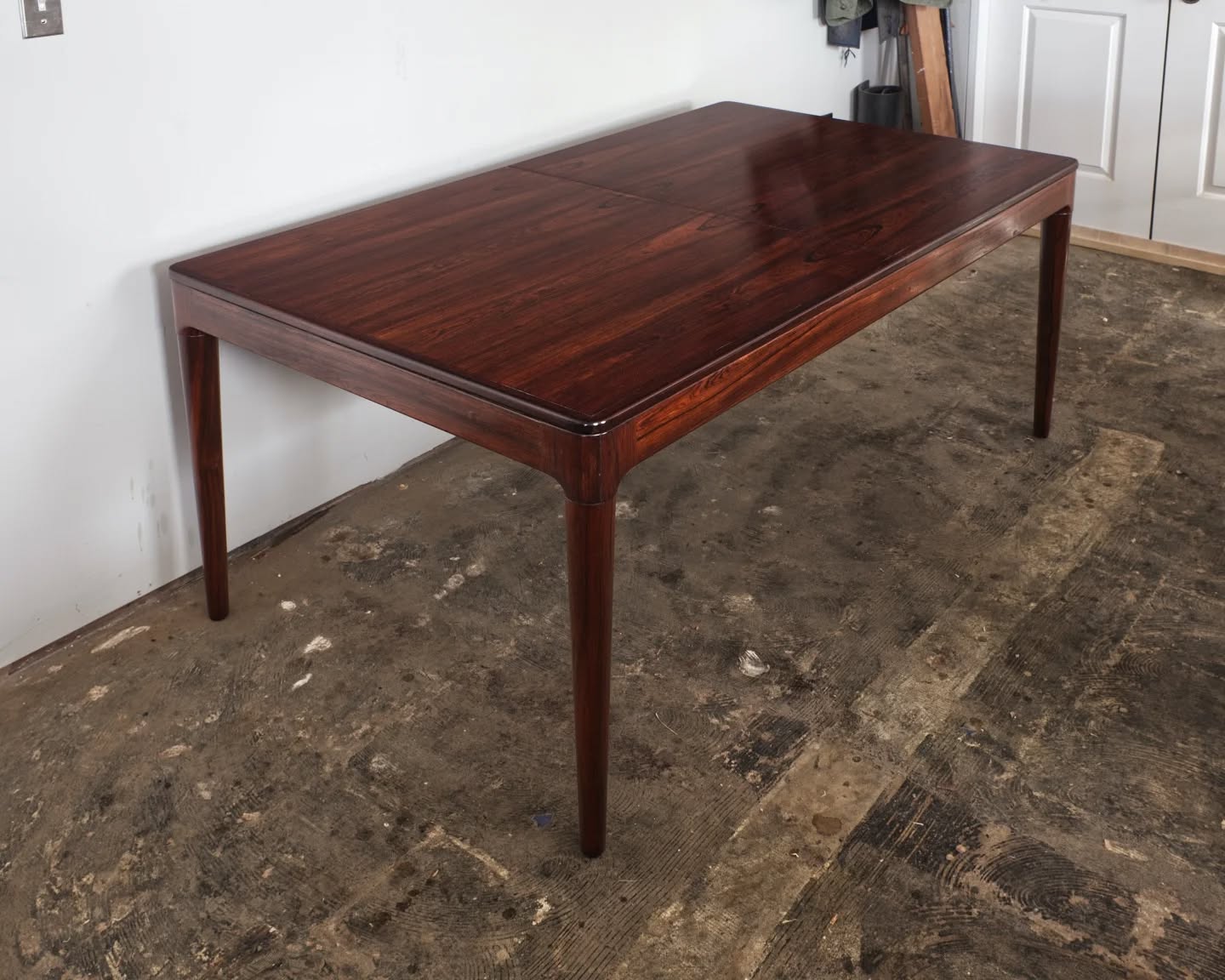 This is a really cool rosewood dining table. Two leaves are hidden inside and can swing up into position when the top halves are pulled open. (One leaf is visible in the third photo.)
The table was wobbly so the base was tightened. The finish on top (very bleached out from decades of UV damage) was removed and missing veneer near the center edge was replaced. Some color balancing and then a new oil varnish finish was applied.
#furniturerestorer #furniturerestoration #danishmodernfurniture #rosewooddiningtable #restoredinbaltimore