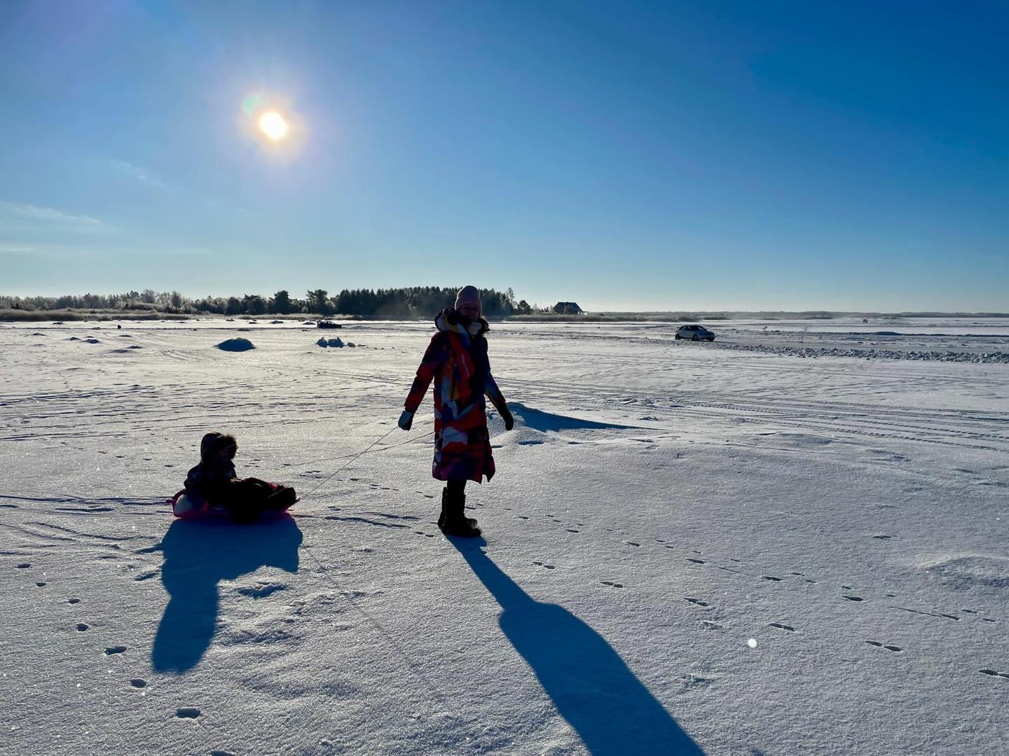 Unsuccesfully trying to make winter sports cool for my 3-year-old. And yes, that is a car driving on the sea.