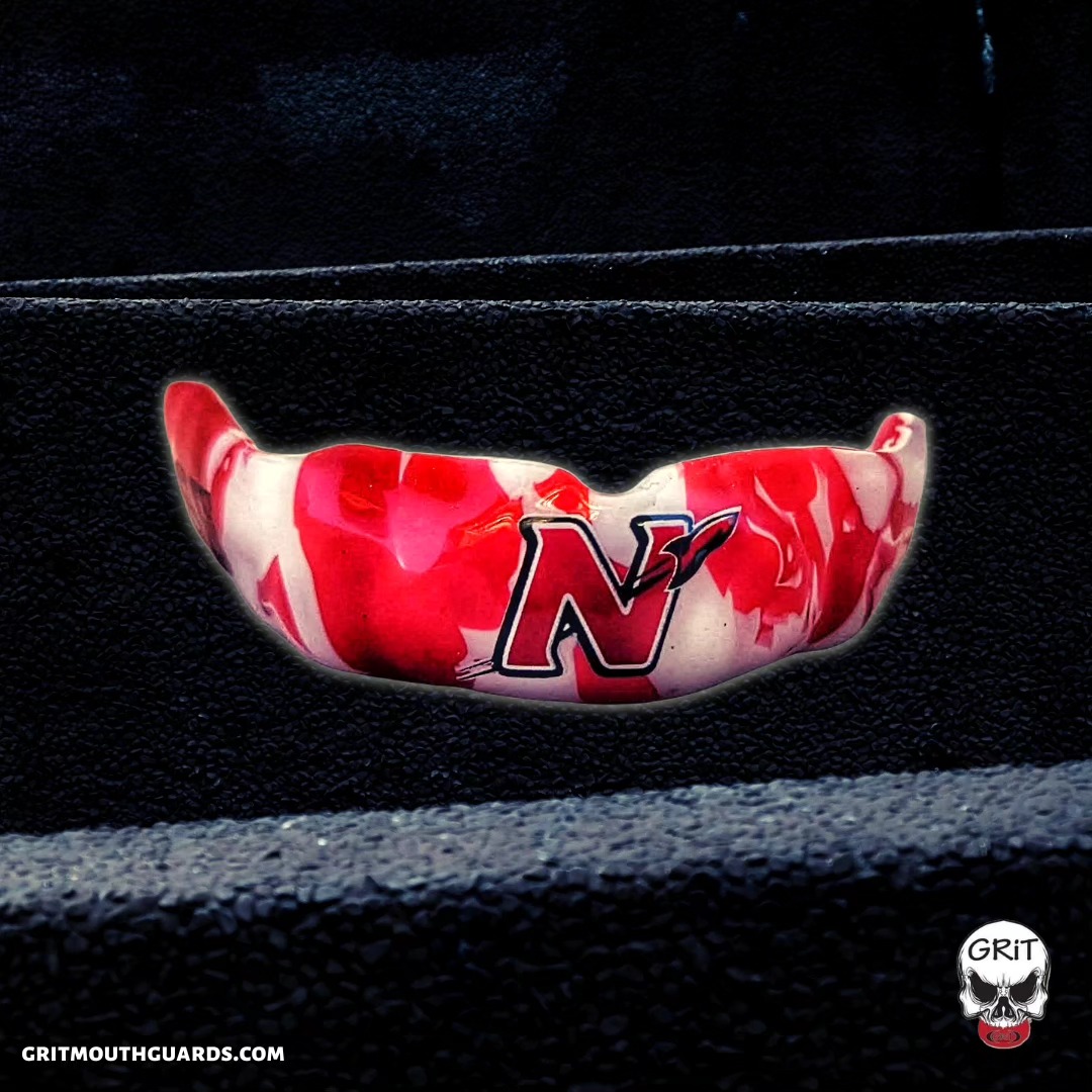 Our custom mouthguard design created for Neenah Rockets Football! Red and white camouflage design with the Neenah Rockets logo across the front. Each back side includes the athlete's last name and jersey number. #neenahrockets #neenahrocketsfootball #football #highschoolfootball #neenah #gritmouthguards #mouthguards