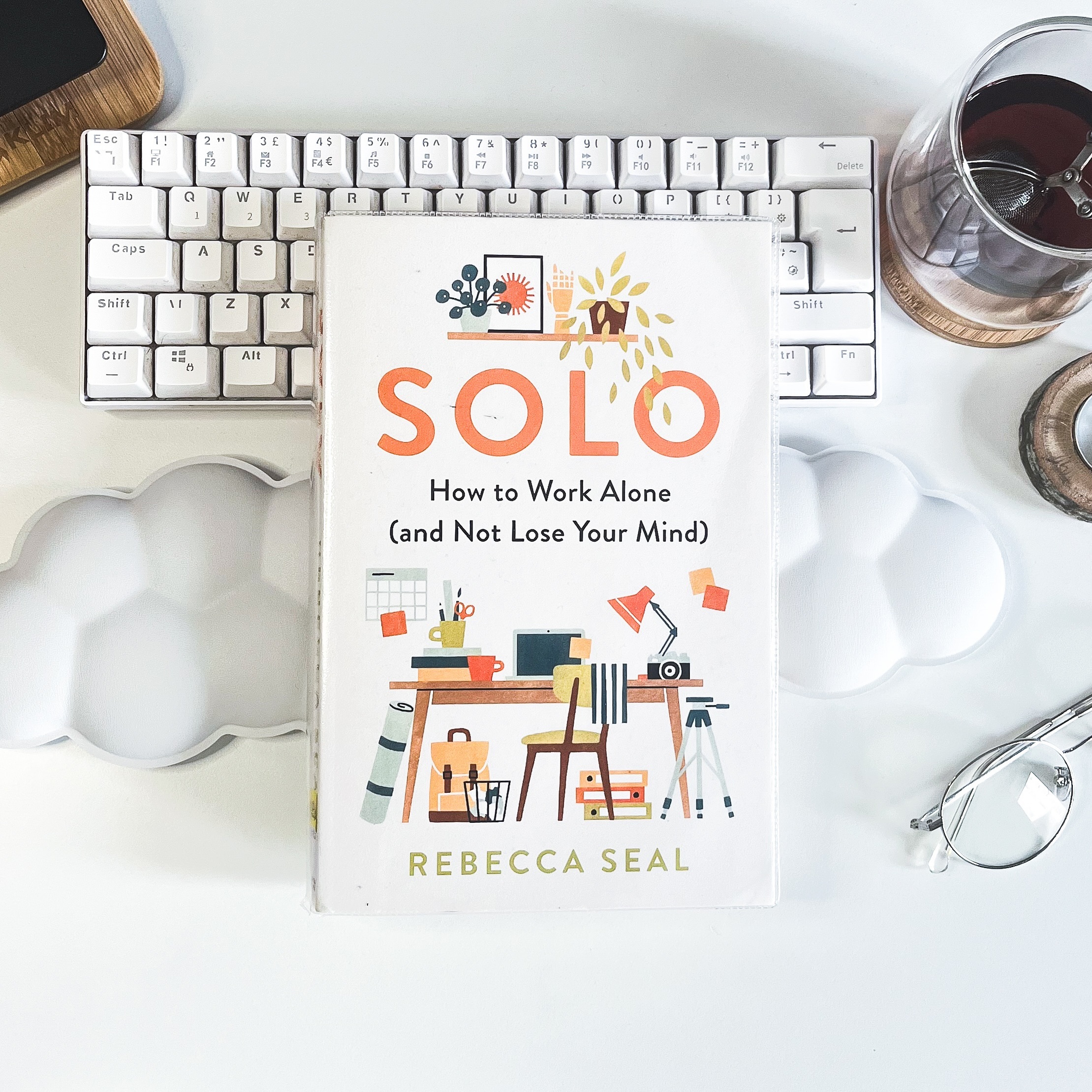 🕘💻 Book Review: Solo: How to Work Alone (and Not Lose Your Mind) by Rebecca Seal ☕✏️
Star Rating: ⭐⭐⭐⭐⭐
Reading Difficulty: 1/5
Length: 304 pages (269 if you exclude notes and index) / 3 hr 57 mins
Available Formats: Paperback, eBook, Audio
Recommended for: Solo workers of all kinds
Review ✒️
This book came to me during my first time experiencing loneliness as a freelancer. Being your own boss and having total control over when and how you work is great but there are downsides which I don’t think is talked about enough online. Working week luxuries like lounging in your PJs, indulging at your favourite café, and popping out to do errands quickly loses its colour if you don’t have kids, pets, or a work-from-home partner. There’s no one to bounce ideas with, to gossip with, to remind you to take breaks, or to eat your lunch with. The silence is deafening.
When I picked up Solo from my local library, I was expecting advice for loneliness as a solo worker, I received SO much more. This book reads like a warm hug from a freelance friend, colleague, and mentor. Rebecca Seal’s ten years of freelancing experience shines through in a way that validates your experiences, concerns, and anxieties, whilst offering advice that is both practical and insightful. There’s no drop of condescension or high-horsing here just overwhelming compassion — “I’ve been there, I get it. This is what I learned.”
This book covers everything a solo worker needs (and doesn’t realise they need) in order to set themselves up for WFH success. Including, but not limited to: how you structure your work day, motivating yourself, working with loneliness, optimising your environment, what you eat (and should be eating), the importance of planning, the detriment of social comparison, building freelance networks, money problems, and even what to do when you’re not working. Needless to say, this book is a must-read for solo workers of all kinds, I’m glad I found it!
Favourite Quotes ❤️
“Time can’t buy happiness - it can give it to you.”
“Appreciating what we can do in solitude, and what solitude can do for us, is a powerful way to make sure there’s no room in it for loneliness.”