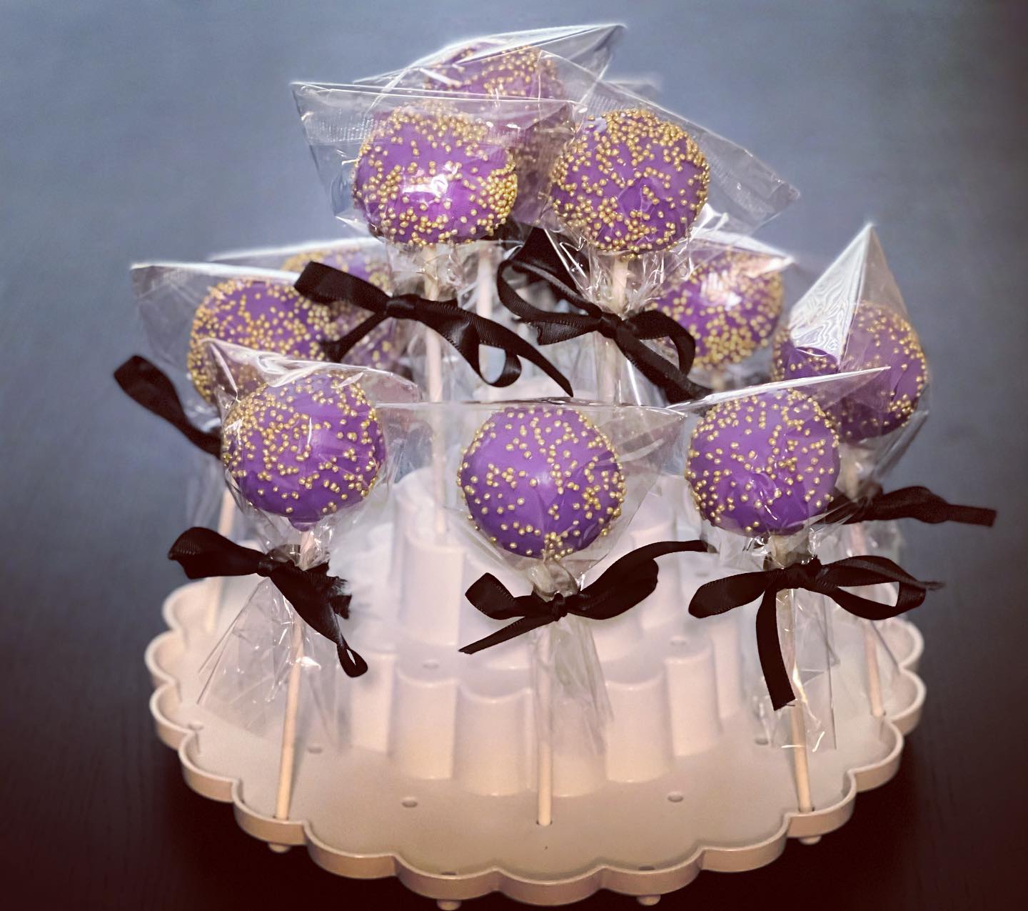 Vanilla and Chocolate Kake Pops decorated in purple and Gold w/ black bows. Thanks for your business!!!