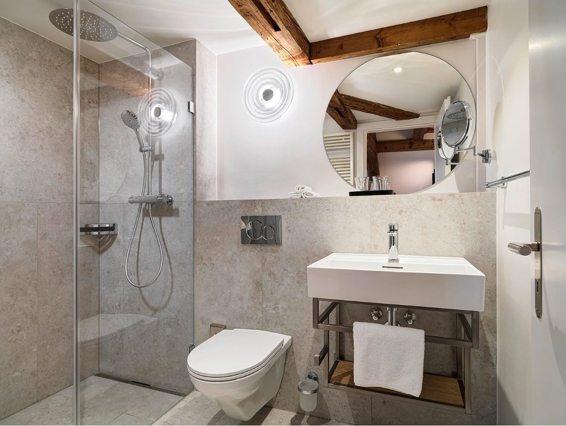 Hotel St. Josef
The renovation of Hotel St. Josef in Zurich beautifully intertwines modern design with deep symbolic and cultural elements. The new design concept celebrates the spirit of Zurich’s Niederdorf district while incorporating the story of St. Joseph, creating a unique atmosphere that combines history, craftsmanship, and modern comfort.
Key Design Features:
1. Warm and Inviting Atmosphere:
• Light parquet flooring adds warmth and a natural aesthetic.
• Delicate oak furniture reflects both quality and craftsmanship, symbolizing St. Joseph’s carpentry heritage.
• Elegant pastel colors enhance the lightness and purity of the rooms, subtly nodding to the white lily, a symbol of faith and chastity.
2. Craftsmanship and Customization:
• Custom-made furniture highlights the artisanal approach and celebrates the art of woodworking, staying true to the legacy of St. Joseph as a craftsman.
• Thoughtfully chosen materials emphasize quality and durability, blending tradition with a contemporary feel.
3. Symbolic Elements:
• The square measure, representing precision and skill, is subtly incorporated into design patterns or motifs.
• The white lily inspires the color palette, bringing freshness and serenity to the space.
I worked on this project as a team member in the interior architecture department of the architecture and design studio IDA14 in Zurich where i was given the opportunity to support the overall concept of the hotel rooms as well as the design of the bathrooms
Design Studio: @ida14_by_karsten_schmidt
Photography by: @bruno_helbling_fotografie
#interiordesign #hoteldesign #interiors #design #zürichcity #zurich #hotelstjosef #craftsmanship #whitelily #aesthetic #moderndesign #oak #pastelcolors #quality #tradition #contemporary