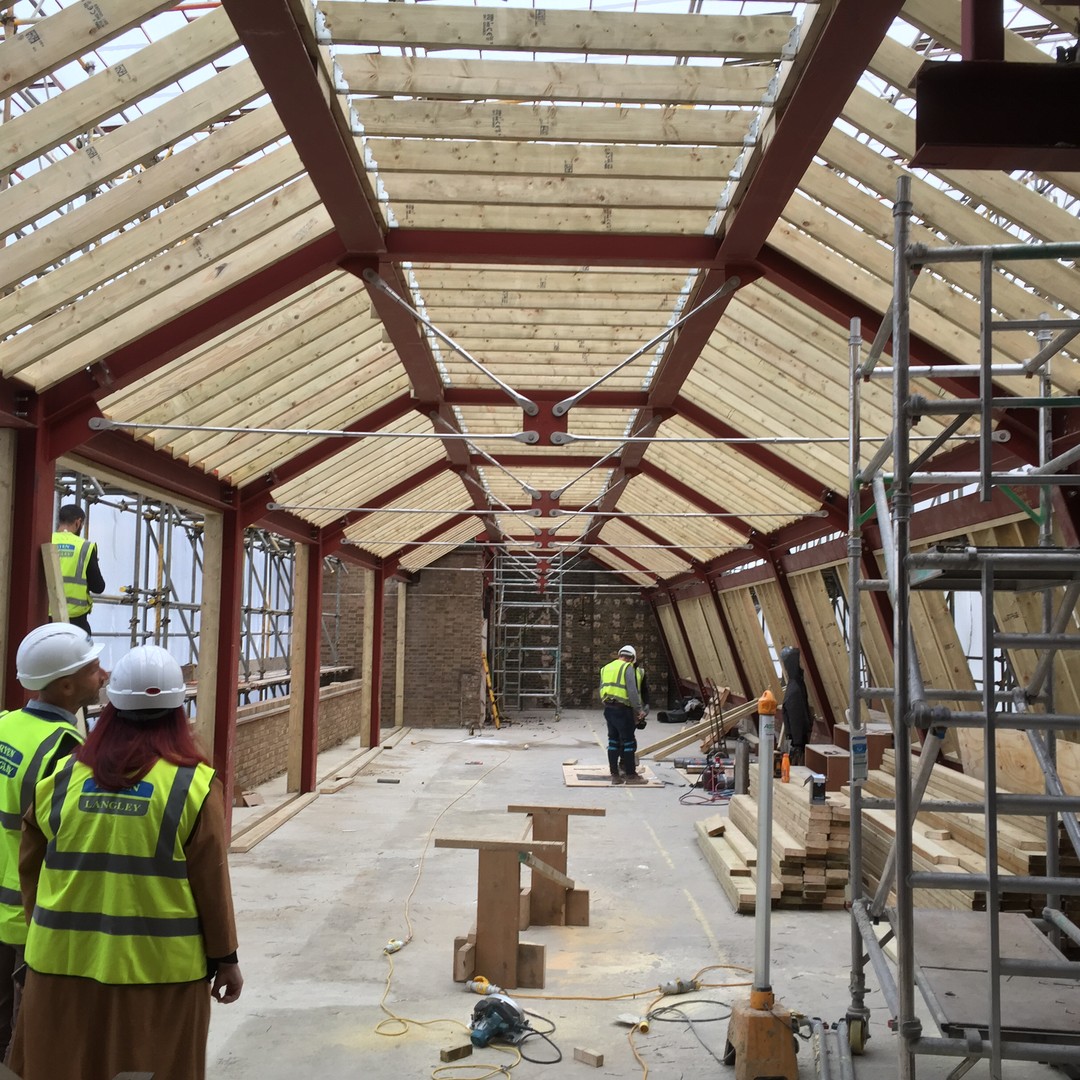 Lisa checking out the new structure at 24 Portland Place #portlandplace #construction #bryenlangley #fairhurstgga