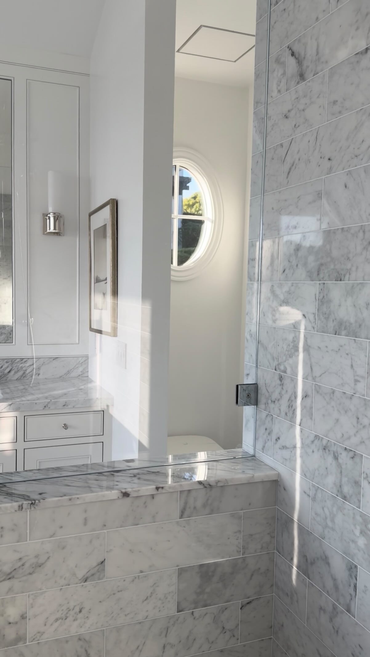 My clients had one request:
Give us an all-white Carrara marble bathroom with nods to a classic London hotel… and make sure we never lose the view of the bay.
Challenge accepted.
We wrapped every surface in Carrara marble and layered in tailored millwork, polished nickel fixtures, and oversized mirrors that captured the light and stunning views from every angle.
At the vanity, in the shower, soaking in the tub… the water is always part of the experience.
Crisp. Timeless. Effortlessly luxurious.
Like checking into a five-star suite… except it’s home.
True paradise ✨😉
#luxuryinteriors #bathroominspiration #bathroomdesignideas #carraramarble #londonaesthetic #paradiseproject