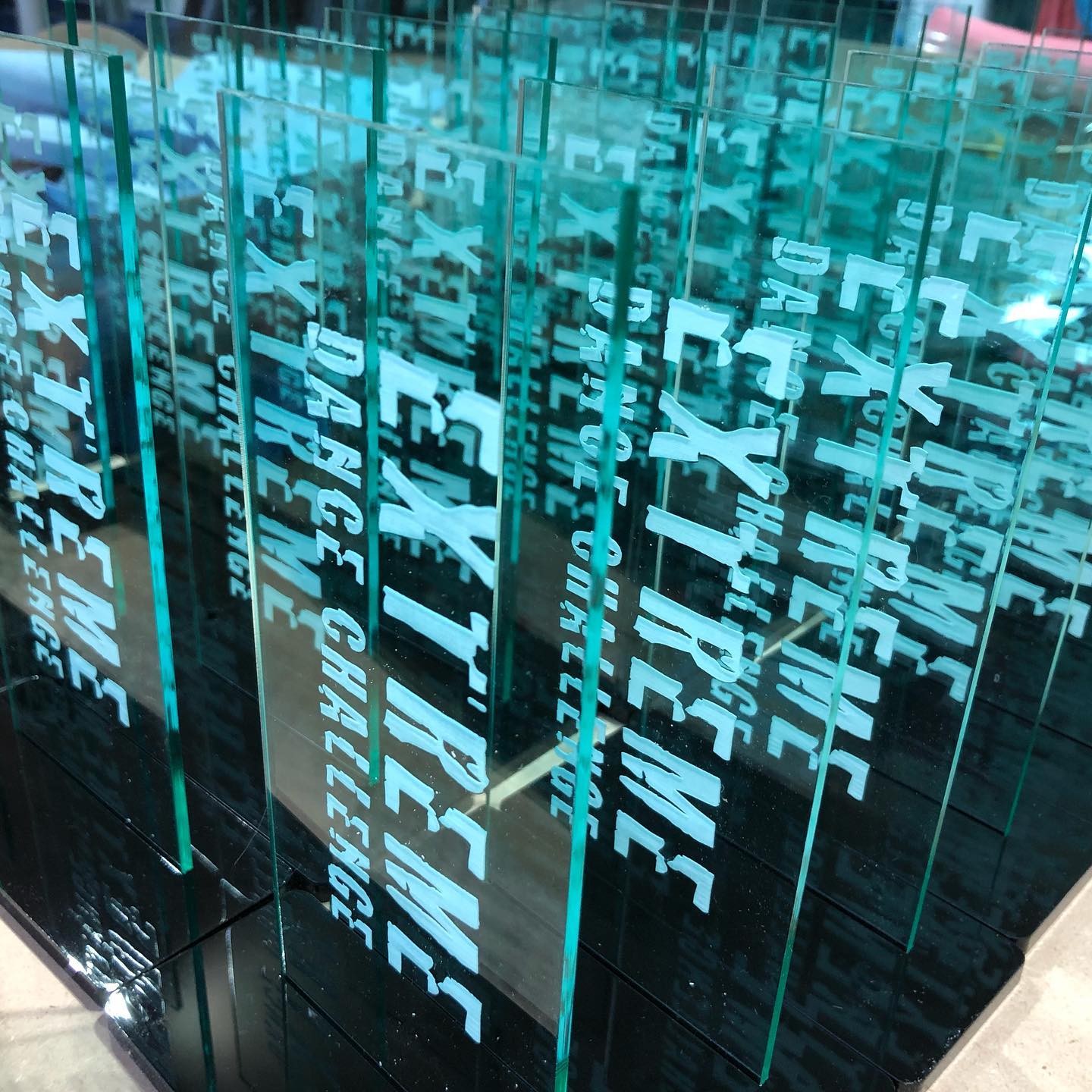 Working on an order for 850 dance trophies! It takes 7 minutes to engrave one trophy. Not including cutting the base, assembling or boxing. Little by little will will get this job done - thanks to my amazing parents that are helping me with this order!! #familytime #liveyourbestlife #thankful