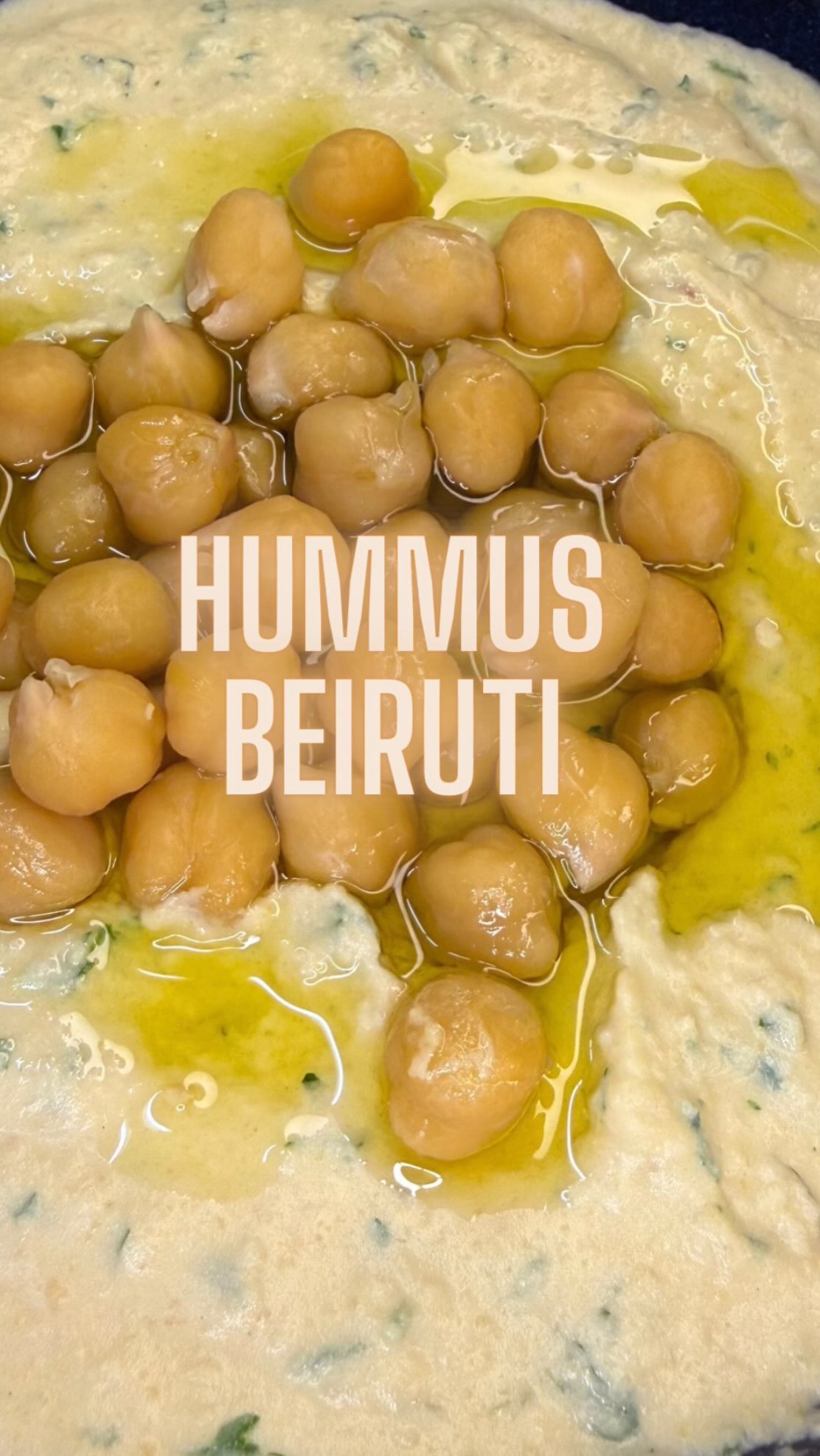 Hummus Beiruti ⬇️⬇️⬇️
RECIPE BELOW
Ingredients
• 250 g cooked chickpeas, drained (reserve 3 tbsp for garnish)
• 1 small green chili pepper, seeds removed (adjust to taste)
• 1 small garlic clove
• Juice of ½ lemon (about 25 ml)
• 4 tbsp tahini
• 1 tsp salt (or to taste)
• 30 g fresh mint, finely chopped
• 50 g fresh parsley, finely chopped
• 1 crushed ice cube
• Extra-virgin olive oil, for garnish
Method
Set aside 3/4 tablespoons of chickpeas for garnish.
In a food processor, add the remaining chickpeas, lemon juice, salt, garlic, chili, and tahini.
Blend until smooth. Add the crushed ice and continue blending until the hummus is light, creamy, and fluffy.
Transfer the hummus to a bowl. Gently fold in the chopped parsley and mint.
Spoon into a serving dish, drizzle generously with olive oil, and top with the reserved chickpeas.#middleeasterncuisine #foodlover #foodie #homemade #cookwithme