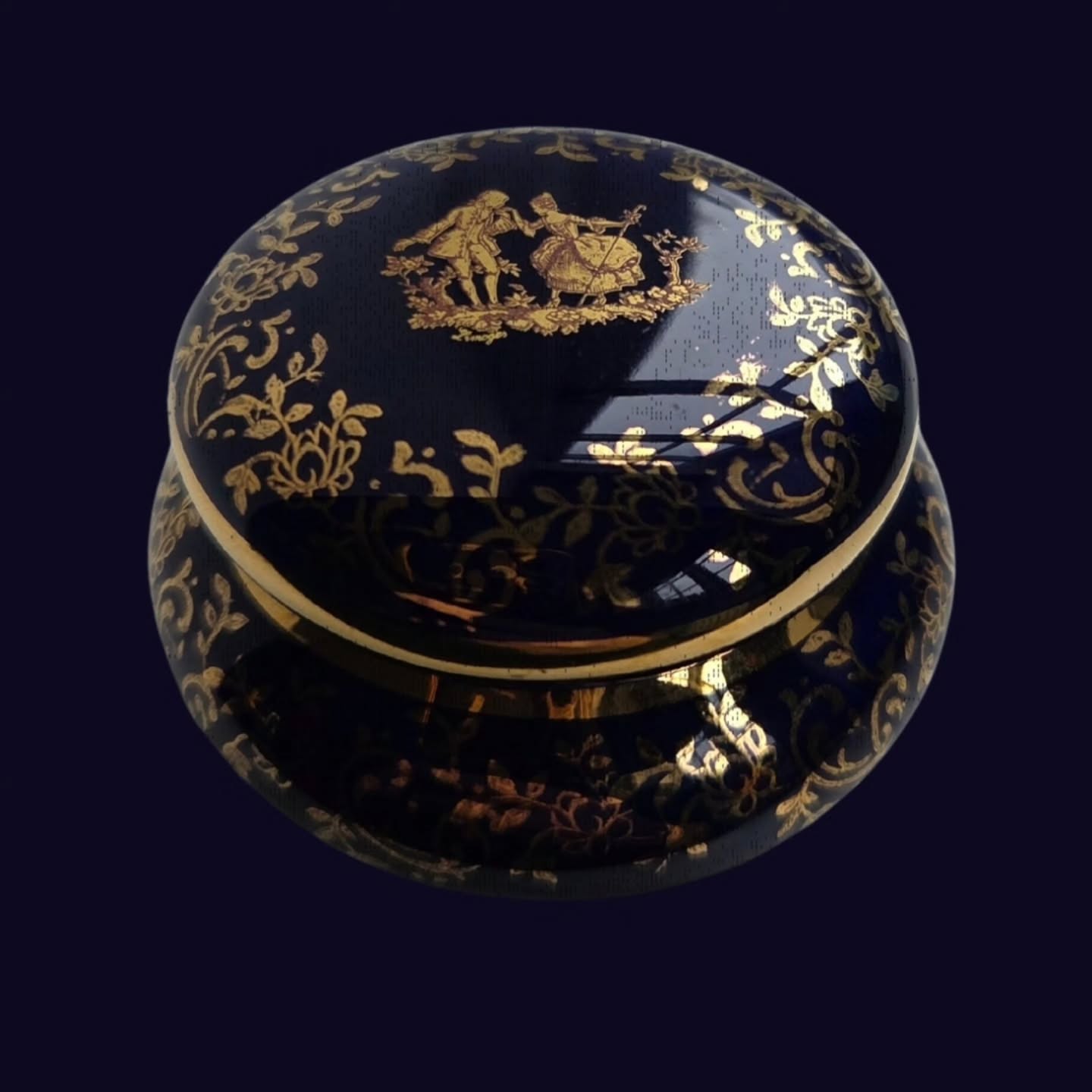 Vintage #Limoges France Cobalt Blue Trinket Box | Gilt Porcelain Lidded Box | French Vanity Ring Box | Romantic Boudoir Decor
A little piece of French elegance for the dressing table.
This charming vintage Limoges porcelain trinket box is finished in a rich cobalt blue glaze and beautifully decorated with gold gilt florals and a romantic courting scene, inspired by the pastoral elegance of 18th-century French design.
Delicate yet practical, the box opens to reveal a smooth interior — perfect for keeping rings, earrings, or tiny treasures safe. The domed lid and generous gilding give it a jewel-like presence, making it as lovely to display as it is to use.
Marked “Limoges France” to the base, this piece was likely produced in the mid-20th century, when Limoges workshops created small decorative luxury items for the gift and export market.
A delightful addition to a vanity, bedside table, or cabinet of curiosities — and a thoughtful gift for lovers of French vintage style.
Details
Origin: Limoges, France 🇫🇷
Date: c. 1940s–1960s
Material: Porcelain with cobalt glaze and gilt decoration
Diameter (base): approx. 5 cm
Diameter (top): approx. 4 cm
Height/depth: approx. 3 cm
Marked: Limoges France to base
Condition
Very good vintage condition.
Light age-related wear to the gilding in places, as expected.
No chips or cracks observed. Lid fits well.