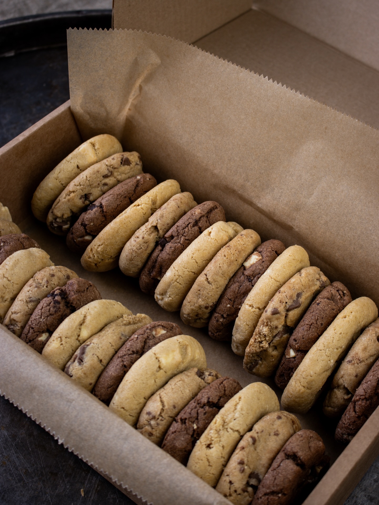 Meet Finchlings, our brand new mini gourmet cookies made exclusively for our trade customers.
Finchlings offer everything you all love about our classic cookies, just a little smaller and brilliantly versatile. Ideal for little hands, or anyone who fancies something sweet without committing to a full-sized bake (because, let’s face it, our standard cookies are marvellously generous!)
Made properly, as always, with local free-range eggs, Belgian chocolate, Little Pod real vanilla and real butter, so you still get that rich, indulgent flavour in every bite. Available in milk chocolate, white chocolate, triple chocolate, or a mixed box of all 3 flavours, these are already shaping up to be a popular seller.
If you’d like Finchlings on your counter, head to www.willow-finch.co.uk to register as a stockist. We’d love to get a box headed your way!