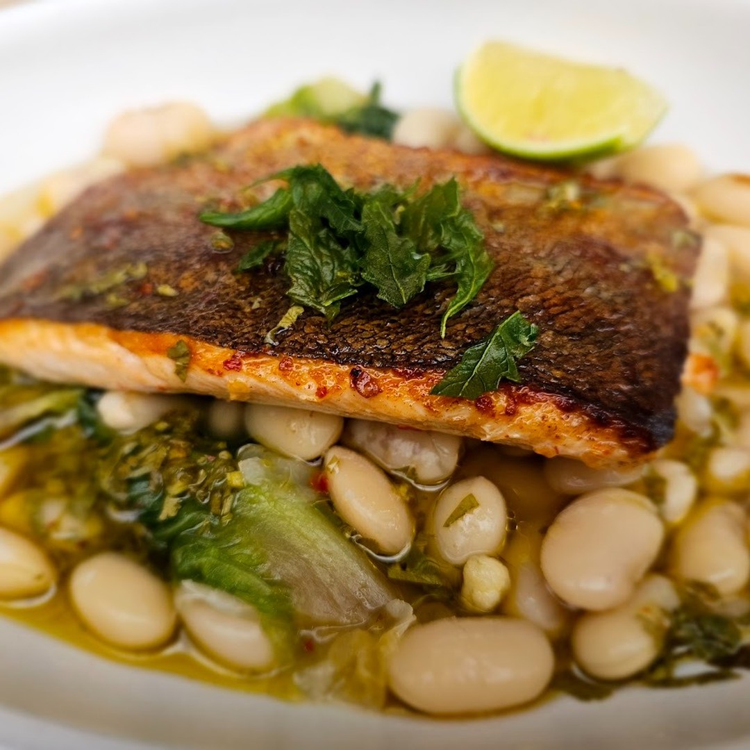 Din-Din at Nopalito.
TRUCHA A LA PLANCHA
Seared marinated trout, arbol chiles, braised butter beans, romanita and salsa verde picante.