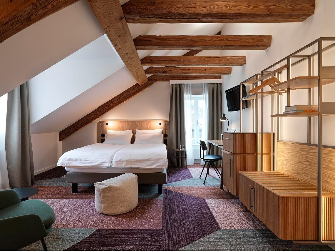 Hotel St. Josef
The renovation of Hotel St. Josef in Zurich beautifully intertwines modern design with deep symbolic and cultural elements. The new design concept celebrates the spirit of Zurich’s Niederdorf district while incorporating the story of St. Joseph, creating a unique atmosphere that combines history, craftsmanship, and modern comfort.
Key Design Features:
1. Warm and Inviting Atmosphere:
• Light parquet flooring adds warmth and a natural aesthetic.
• Delicate oak furniture reflects both quality and craftsmanship, symbolizing St. Joseph’s carpentry heritage.
• Elegant pastel colors enhance the lightness and purity of the rooms, subtly nodding to the white lily, a symbol of faith and chastity.
2. Craftsmanship and Customization:
• Custom-made furniture highlights the artisanal approach and celebrates the art of woodworking, staying true to the legacy of St. Joseph as a craftsman.
• Thoughtfully chosen materials emphasize quality and durability, blending tradition with a contemporary feel.
3. Symbolic Elements:
• The square measure, representing precision and skill, is subtly incorporated into design patterns or motifs.
• The white lily inspires the color palette, bringing freshness and serenity to the space.
I worked on this project as a team member in the interior architecture department of the architecture and design studio IDA14 in Zurich where i was given the opportunity to support the overall concept of the hotel rooms as well as the design of the bathrooms
Design Studio: @ida14_by_karsten_schmidt
Photography by: @bruno_helbling_fotografie
#interiordesign #hoteldesign #interiors #design #zürichcity #zurich #hotelstjosef #craftsmanship #whitelily #aesthetic #moderndesign #oak #pastelcolors #quality #tradition #contemporary
