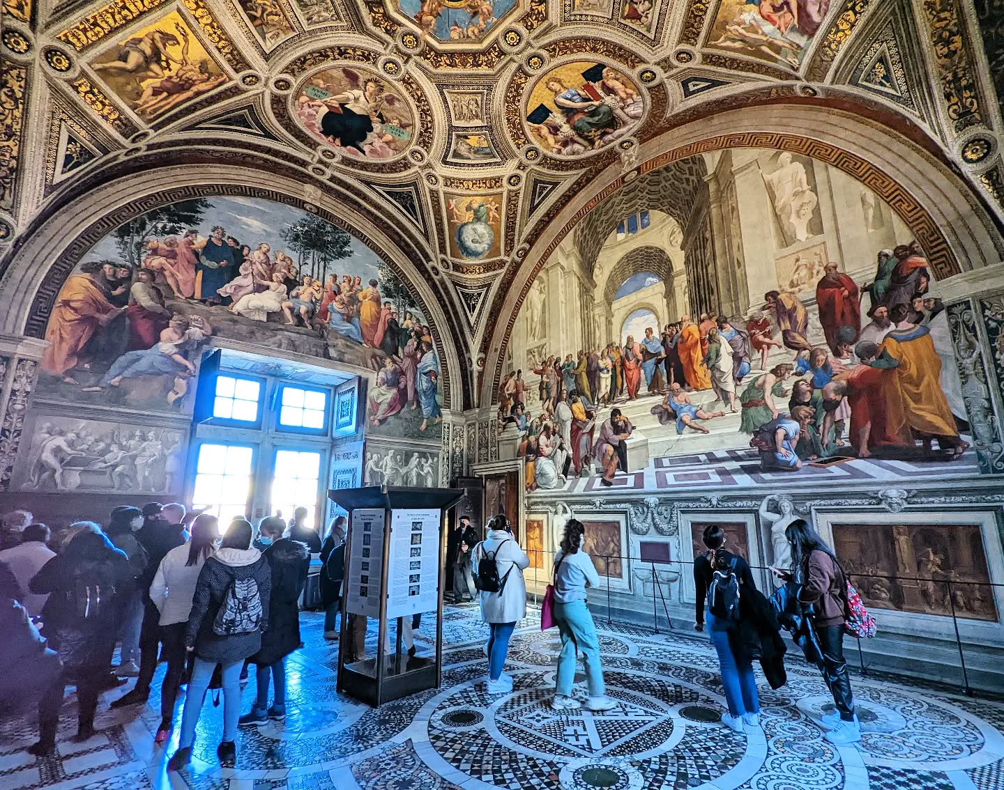 Raphael worked on his masterpieces in the Vatican at the same time Michelangelo was working on the Sistine Chapel. The School of Athens is a well known work of art, and this photo provides some context, showing just how large it is! Note also the details of Michaelangelo, traditionally a late addition to the fresco by Raphael - included after Raphael was overwhelmed with a peek into the Sistine Chapel. #latinrocks #raphael #renaissanceart
