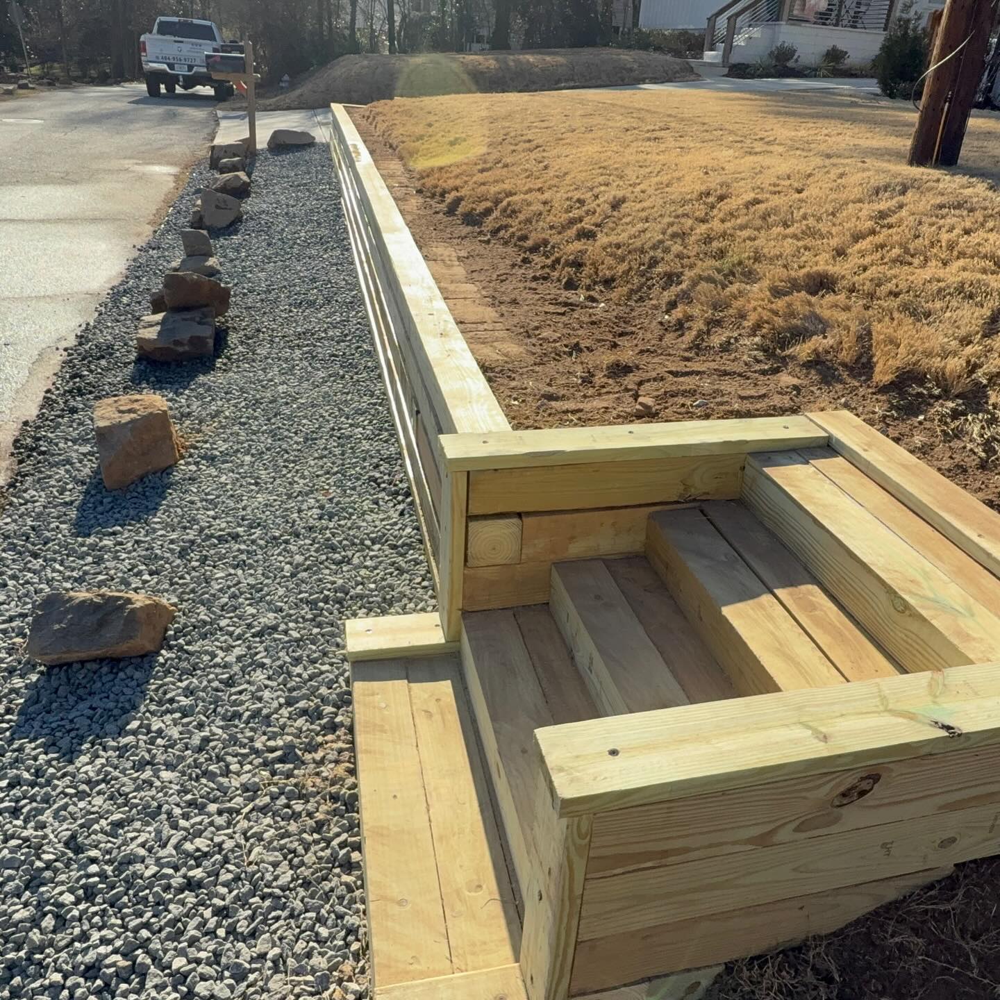 What a fun project. We love when the work area is right next to the road, makes material transport a breeze. Timber tie retaining wall build in Smyrna!