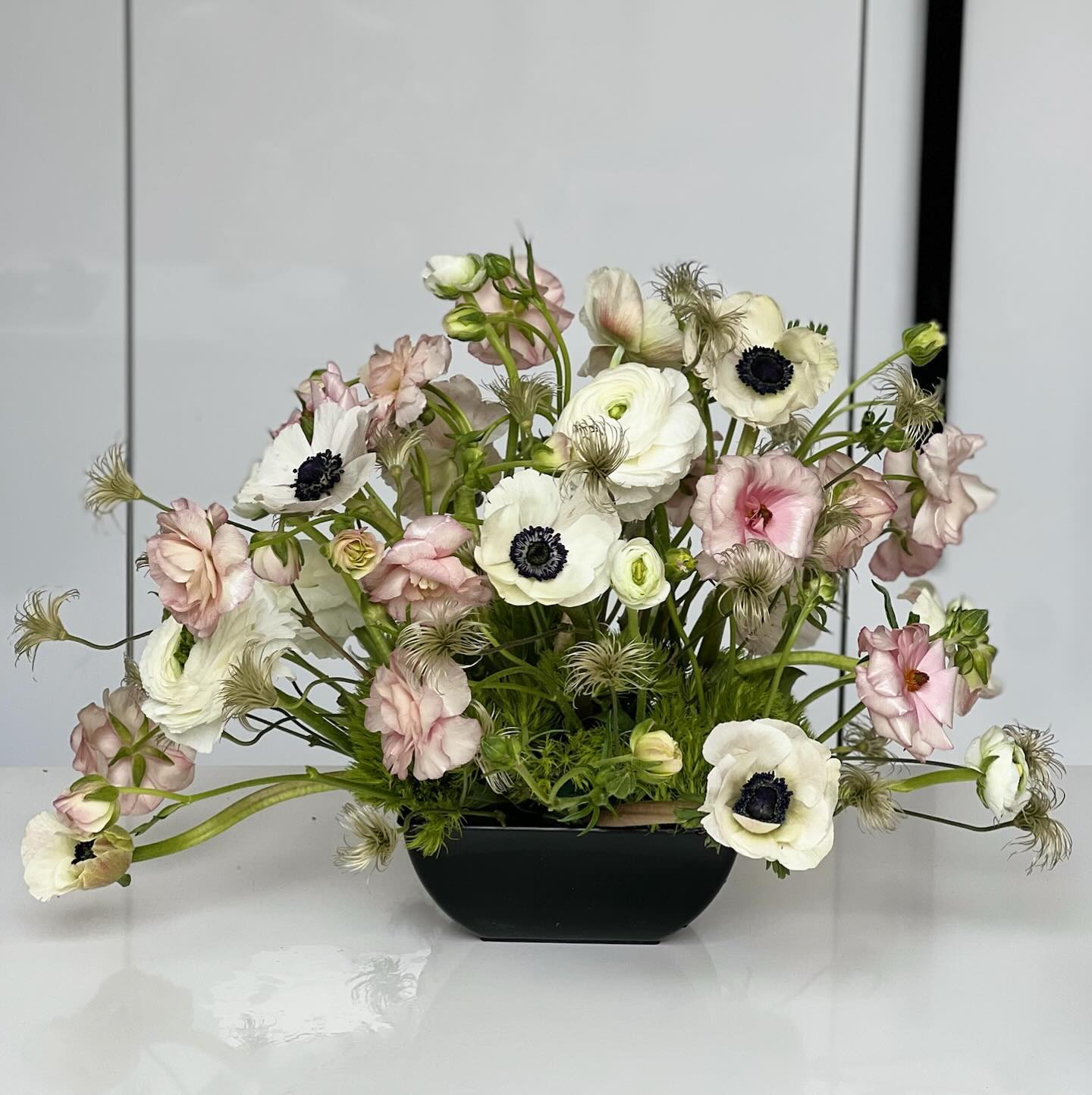 Delicate anemones are the star of this arrangement!