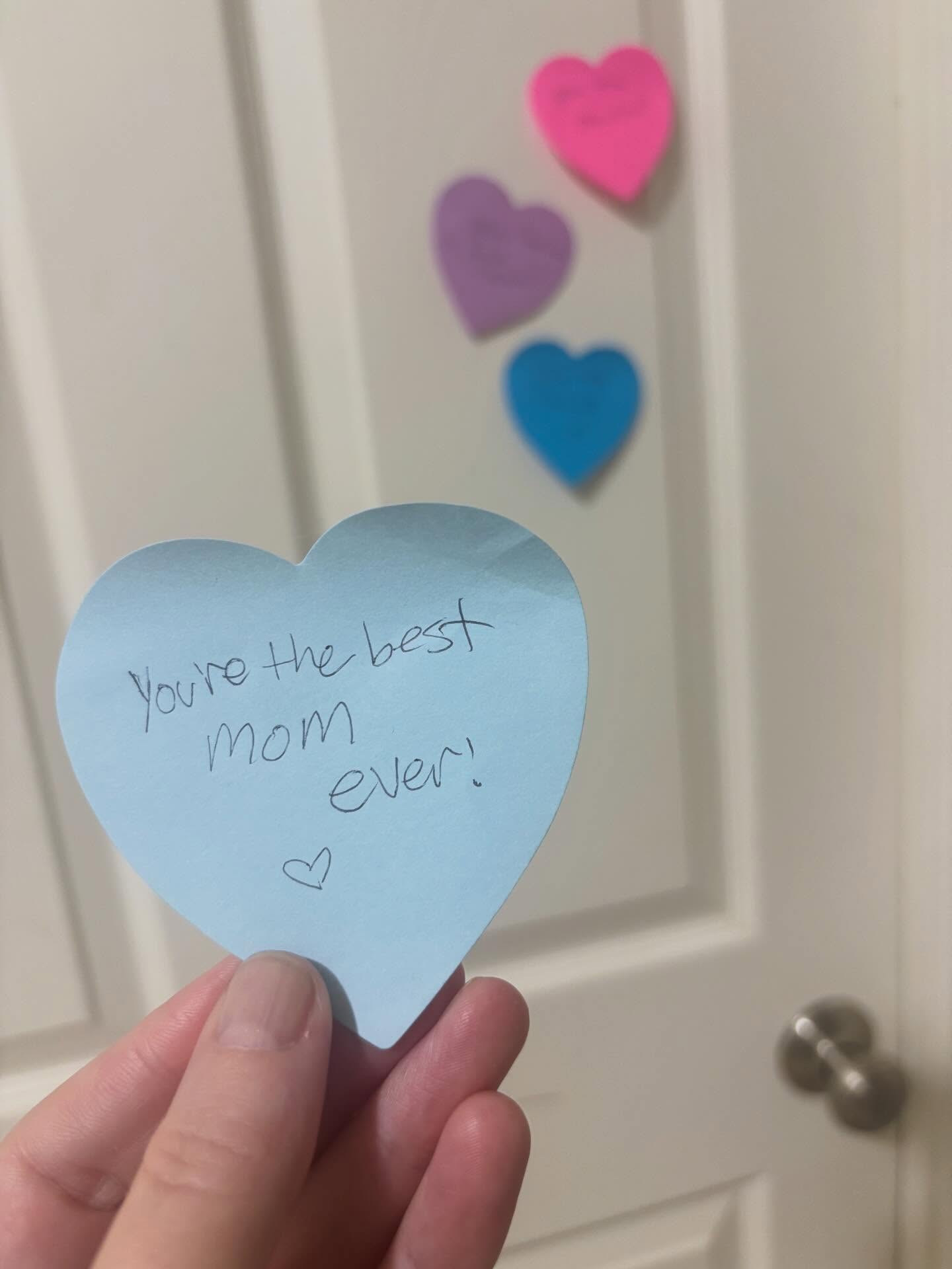 During February, I love putting hearts on my kids’ doors with little affirmations about them. Every morning they wake up to a special message, just hoping they feel a little extra loved during a month that’s commercially centered around love everywhere you turn.
I know it seems so small, but any excuse to love on them a little more feels worth it.
And it really is that simple. I use heart-shaped sticky notes and write one sentence. That’s it. It takes less than five minutes each morning for all three kids.
This year, I woke up to my own special message from them. My heart. 🥺
Parents, this is your reminder that the little things matter. Your kids are paying attention, and what goes around really does come around. 💜
#itsthelittlethings #parenting #valentinesday