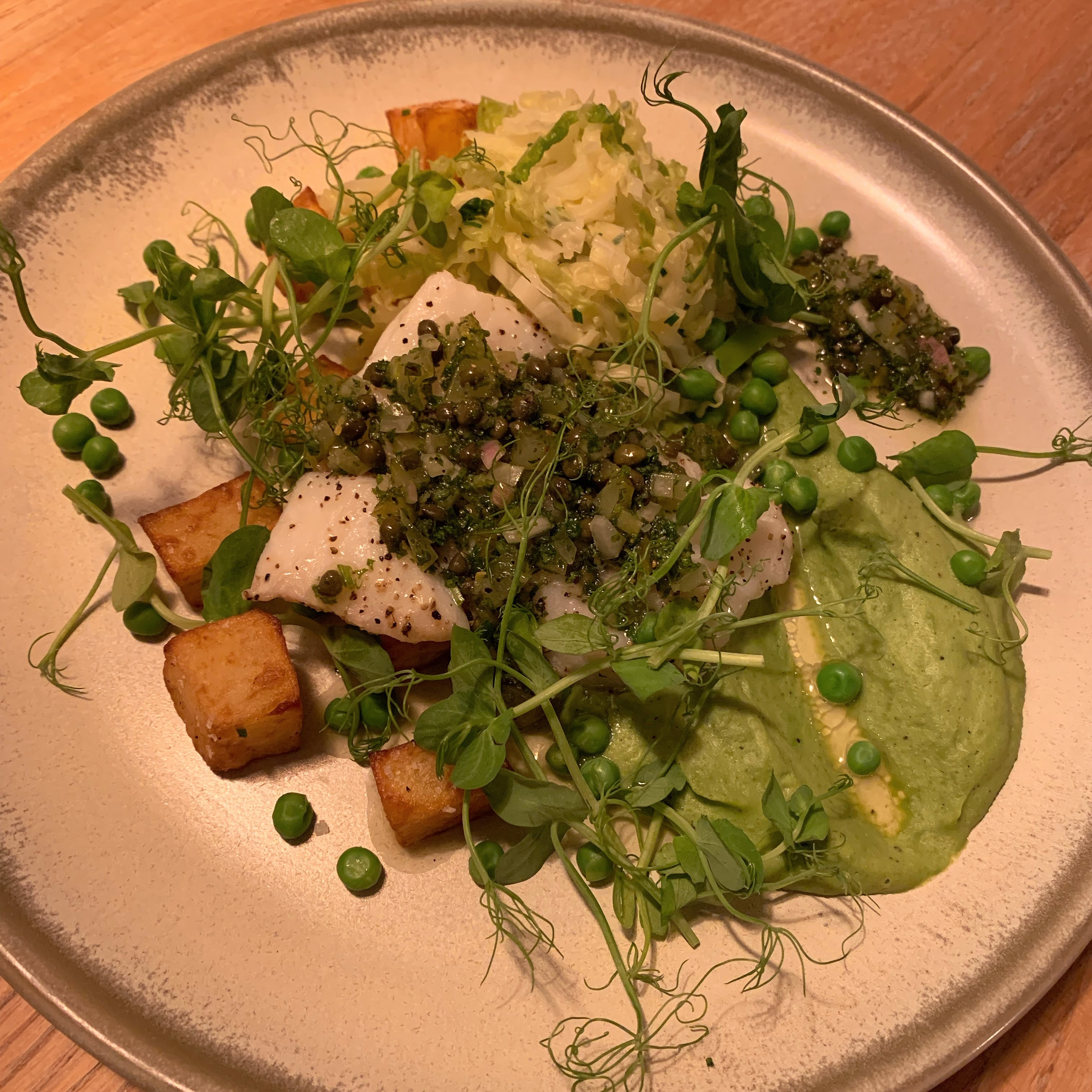 Our special this evening! Oven baked cod fillet, crispy parmentier potatoes, pea purée, salsa verde