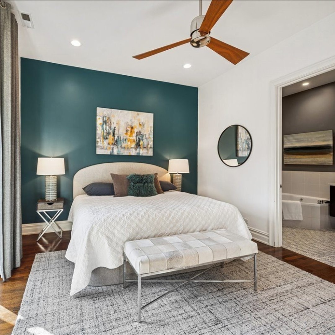 We took color cues from this accent wall to influence the artwork, lamps, and accent pillows we selected. While keeping the larger pieces and bedding light and bright to offset the dark hue. And we used one of our favorite simple tricks — a mirror opposite the windows to bounce in as much light as possible! #tipsandtricks #styling #chicago #chicagorealestate #havenhomestager #chicagohomestaging #stagingworks #stagingsells #staging #homestaging