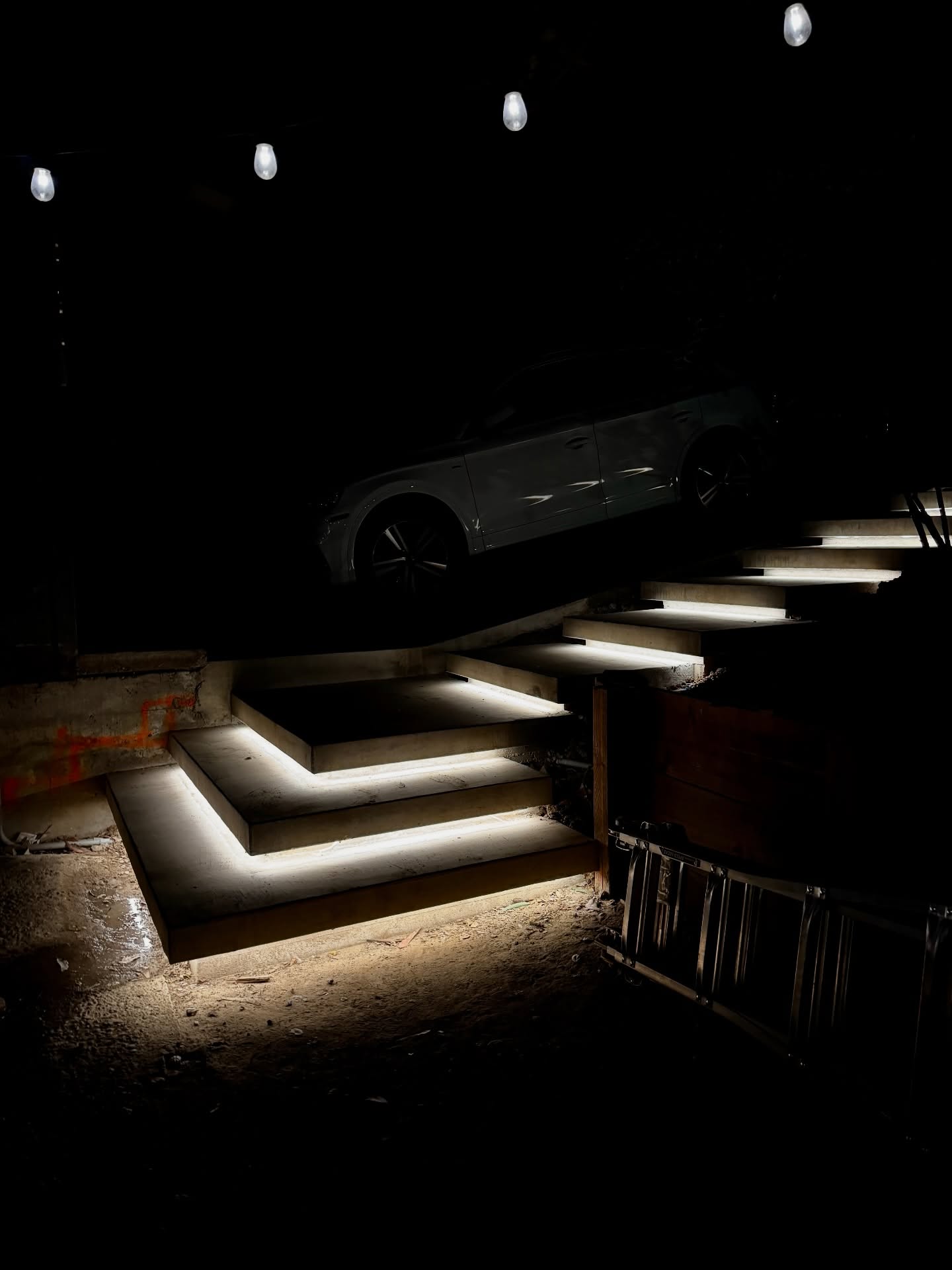 Night view of custom concrete hillside steps featuring integrated LED under-tread lighting.
The illumination highlights the floating design, enhances safety after dark, and adds a clean, modern architectural statement—built to perform and look exceptional day or night.