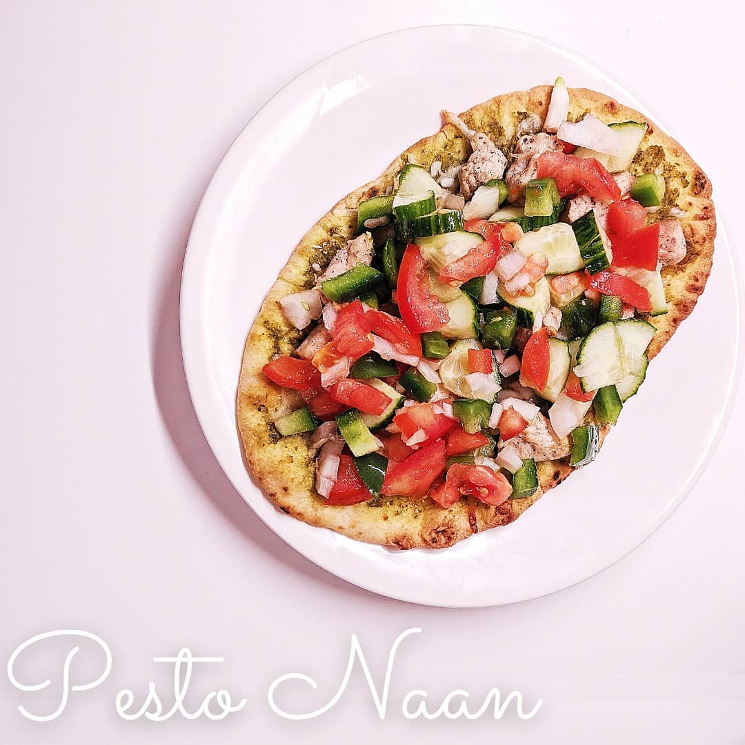 Looking for a quick lunch option at home? Look no further!
This pesto naan has everything you need to stay full till dinner.
-- PROTEIN: 4 oz pre-cooked chicken
-- HEALTHY FAT: pesto for the base
-- FIBER: about 1 cup cucumber, tomato, onion and green pepper
Throw the naan in the toaster oven while you chop your veggies. After it has started to crisp up, add the pesto and chicken, and toast it until chicken is warm. Pull it out to top with veggies then sprinkle with salt and pepper.
My husband prefers to toast it for a few more minutes to warm the veggies, but I prefer the contrast of hot and cold. Do whatever floats your boat! โต