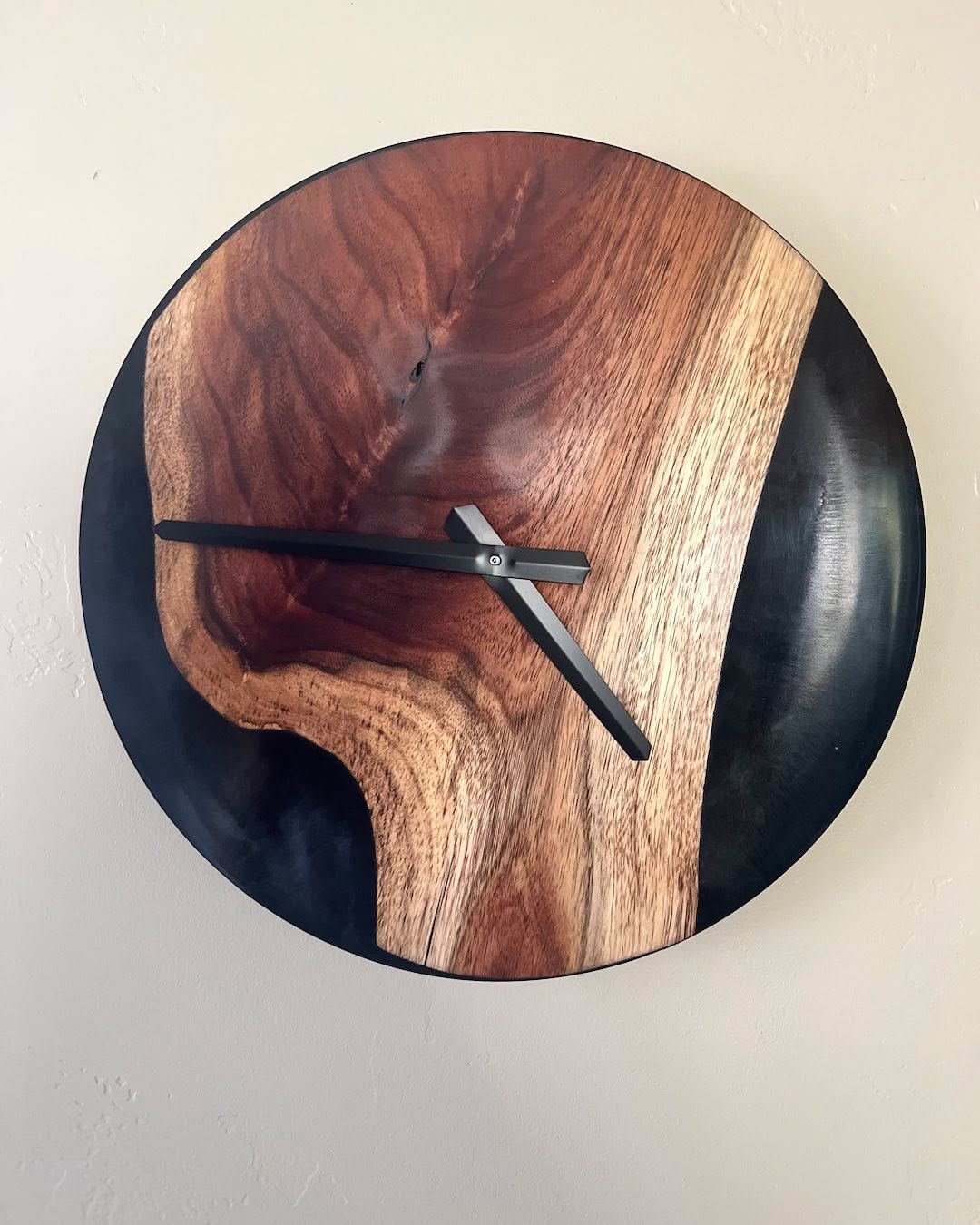 Live edge black acacia clock with black resin.