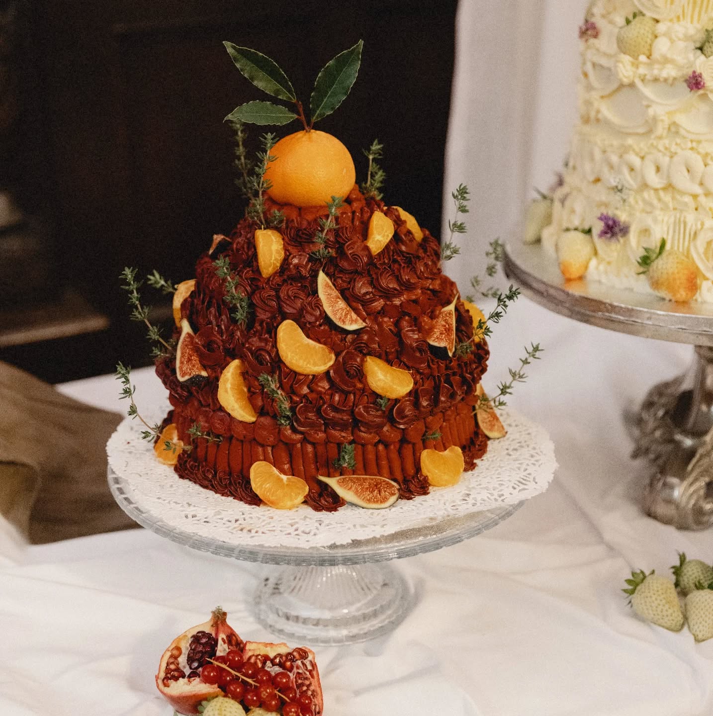 A weekend where nothing was meant to be too neat - and everything was intentional ❤️
" I gave Nicole a brief that was A LOT: it was a multi-page document describing “kitsch / opulent / garish” cakes inspired by Victorian plasterwork, still-life paintings, and banquet tables from the 1600s.
And Nicole didn’t just understand it, she translated it into edible sculpture. Every detail was perfect: the heavy, sculptural buttercream, the lopsided antique feel, the mix of ripe and green strawberries, the lush abundance of fruit (that she sculpted from marzipan!!! unbelievable!). Each cake looked like it had stepped out of a Dutch still-life painting and into my wedding. They were absurdly beautiful, totally unique, and (somehow!!!) even more delicious than they looked.
I told Nicole the cakes were almost as important to me as marrying my husband LOL, and honestly, looking at them now, I still don’t think I was exaggerating. I can’t recommend Nicole enough. She made my most insane dreams come to life and gave us cakes I’ll be thinking about forever! " Ann Marie
#huntshamcourt #quirkyweddingcakes #huntshamcourtweddings