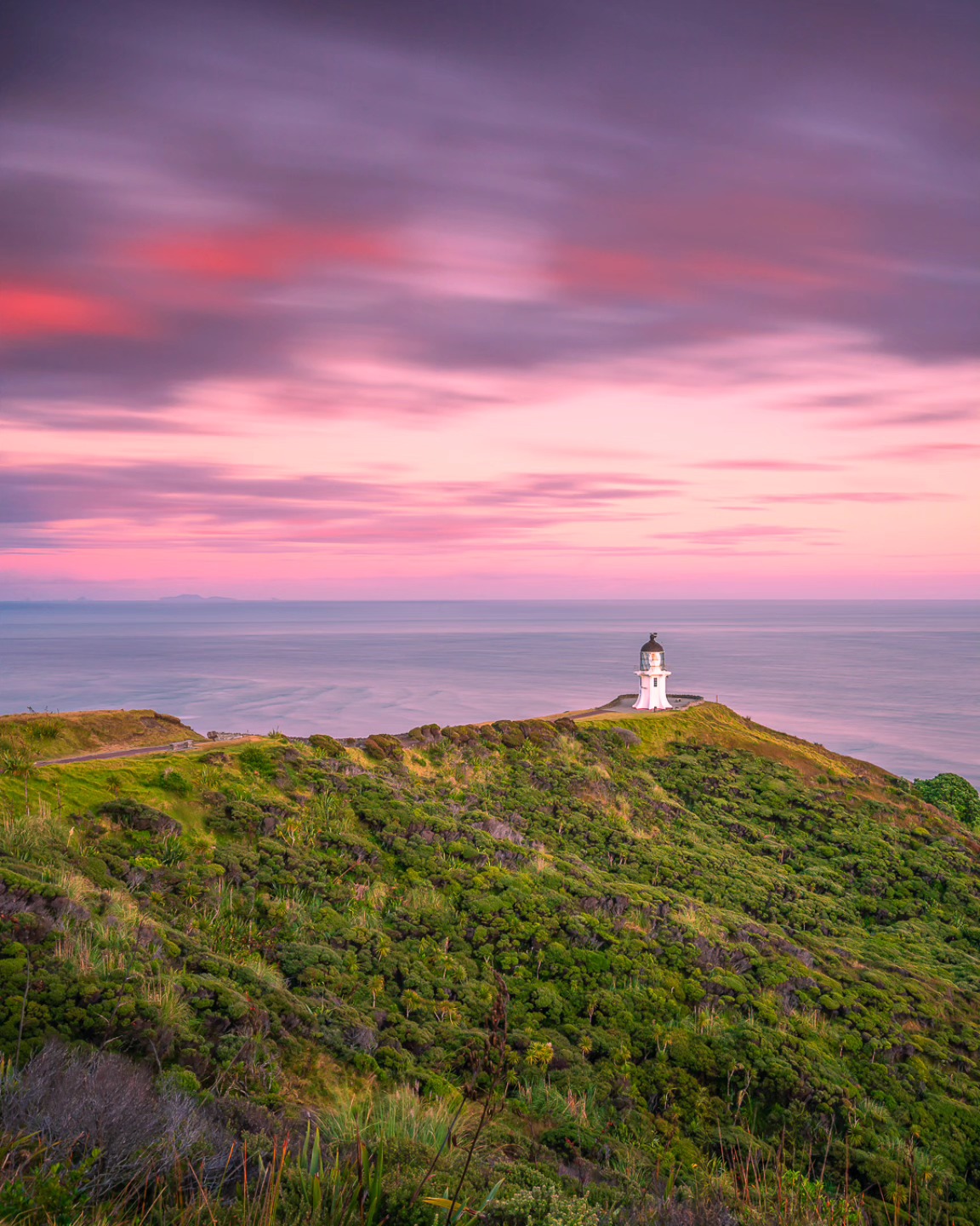 Catching the first light at Cape Reinga, the northernmost tip of New Zealand, where two oceans meet 🌅🌊