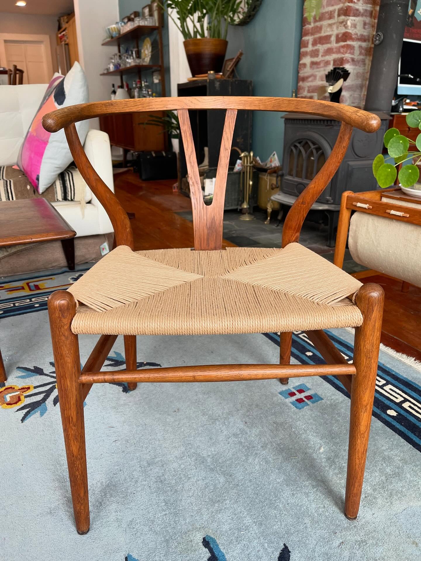 UPDATE: SOLD - Mid-Century Modern Danish dining/side chair designed by Hans J. Wegner for Carl Hansen & Søn manufactured in Odense, Denmark. This beautiful chair exhibits a sculpted oak frame and handwoven paper cord seat, professionally replaced. Backrest transitions to armrest in one solid bentwood piece supported by its signature ‘Y’ wishbone design. This is an early example of this iconic chair and is branded underneath. In excellent structural and aesthetic condition.
Dimensions: 21.25″ W, 20.5″ D, 28.75″ H
Please DM for details or to purchase. FCFS, serious inquiries only please. Local pickup, or delivery is possible for an extra fee. No shipping. Thanks for looking.
#wishbonechair #carlhansenandson #hanswegner #hansjwegner #danishmodern #midcenturyfurniture #designicon