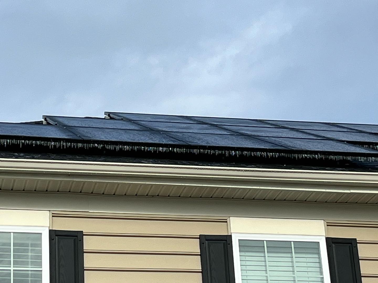 Ice Ice Baby! Please do not go on your roof to scrape off panels. They will melt naturally and the loss of production for a few hours is not worth risking injury and could damage the panels.