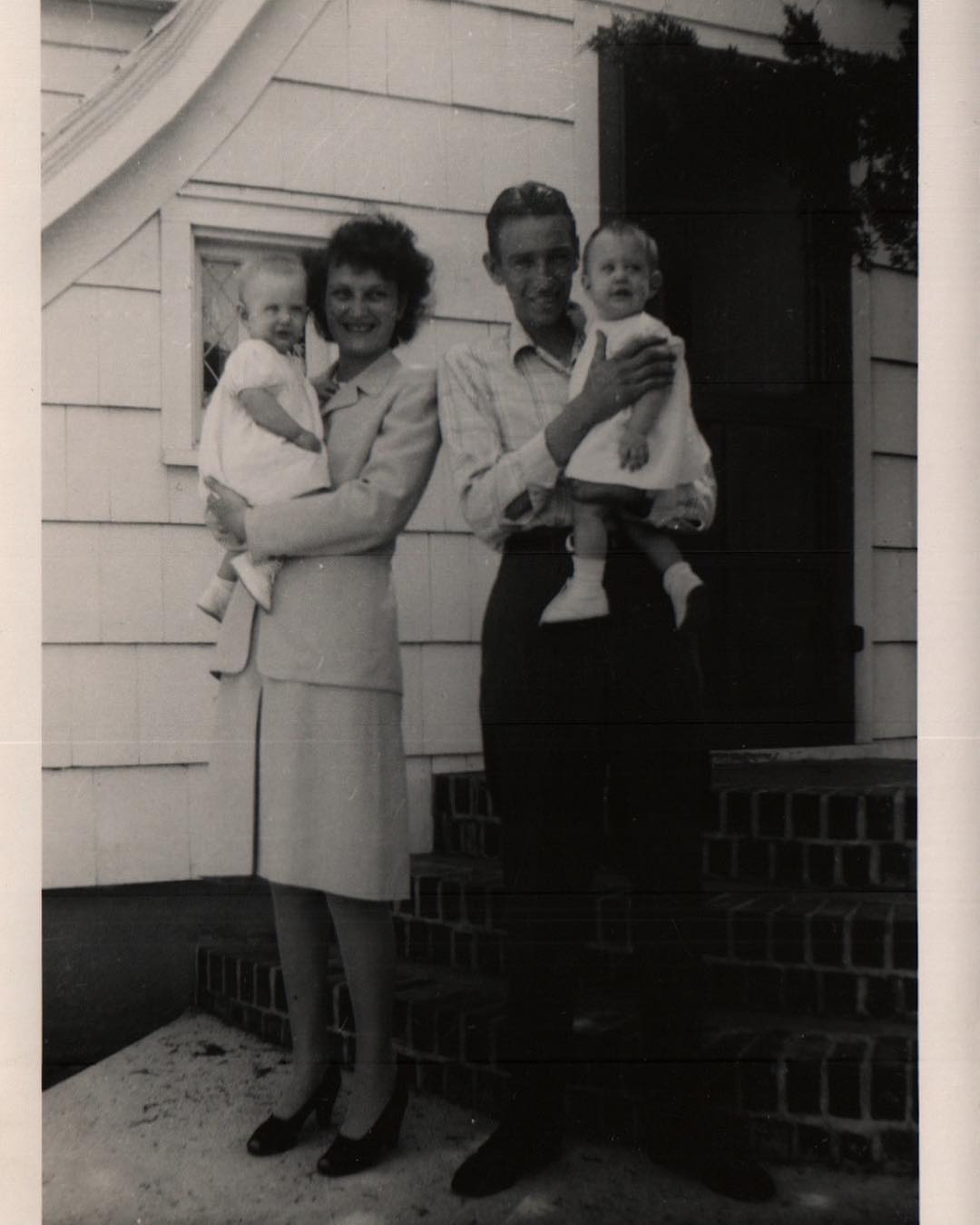 #tbt Part I: Sterling, Kansas • 1944 Catherine & Bryce Proffitt holding their twin daughters on the front steps of the farmhouse her father built.