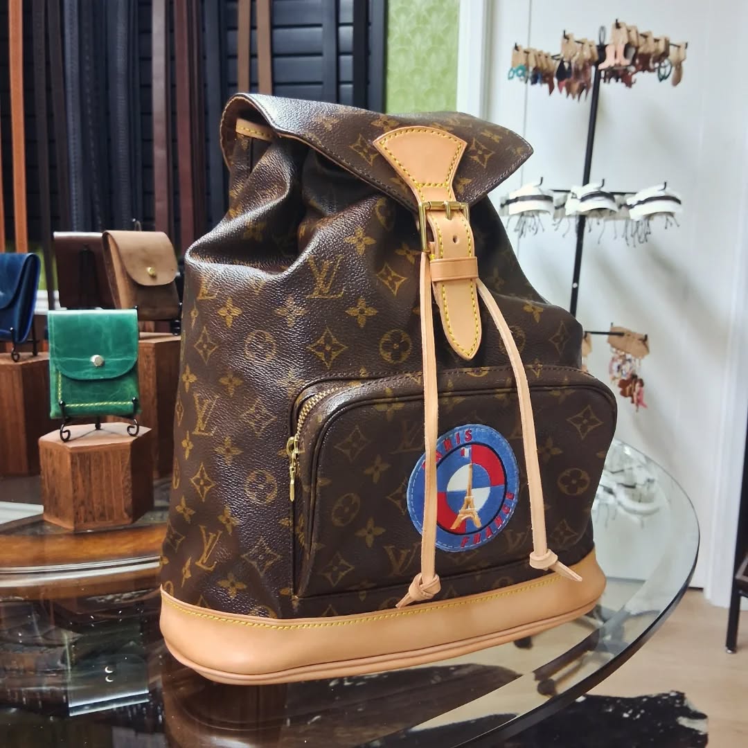 Finished up this LV backpack today. Was a complete rebuild. Not very happy with Craftmore's two piece grommets. Major burs on inside cylinder edge. Gonna have to sand them out. #luoisvuitton #lux #luxury #luxurybag #backpack