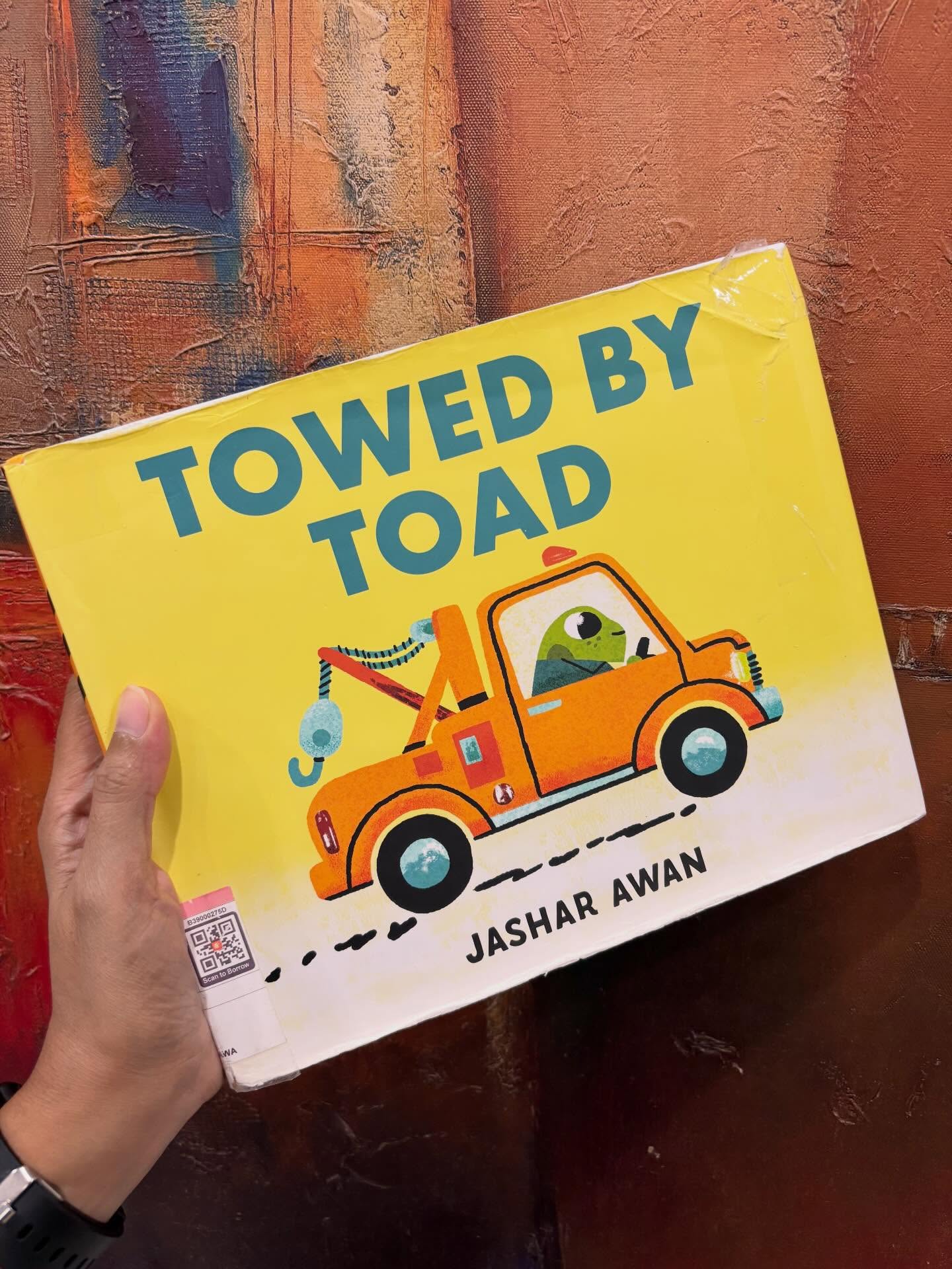 When adults in the kidlit world review newly released children’s literature or in-the-pipeline DRCs, we try to look at books from the lens of a child. We make informed assumptions about what the little ones are likely to gravitate towards, what might catch their fancy. When the book eventually earns one of the coveted stickers, it feels like a quiet validation of our instinct in predicting the little human’s choice.
But the real validation comes from how often the book is picked up by the mini readers that it is meant for and by this yardstick, Jashar Awan’s “Towed by Toad” is a thoroughly kid-approved winner! I picked it up from the “just returned” trolley at the public library: many pages mended, once-crisp pages now well-thumbed, the jacket’s edges gentled by many readings.
And yet the charm of Toad remains, ever ready to help, as the book passes from hand to eager hand, with no time to stop. That, surely, is the mark of a true winner!
#kidlit #readlikeawolfeats #mitrasuggests #picturebook #towedbytoad
