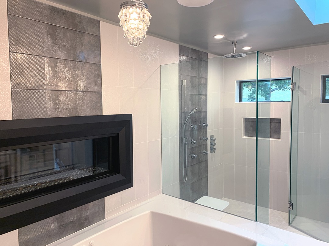Master Bathroom remodel with a double sided liner glass fireplace into your master bedroom. Give us a call. Visit www.ajccon.com #kitchens #contractor #ridgefieldct #Ridgefieldcontractor #hometheater #basement #homeoffice #remodel #addition #bathrooms