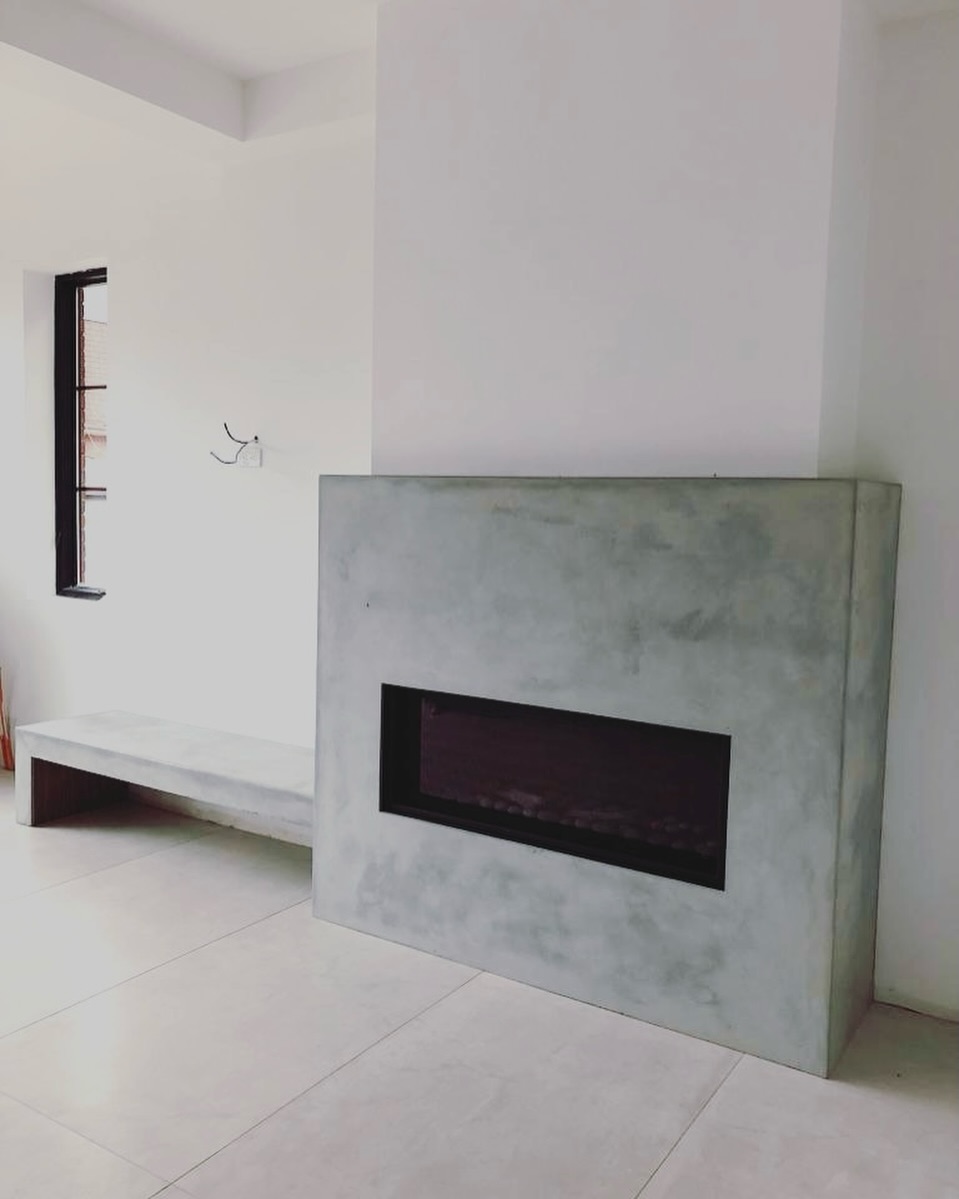From raw material to refined form. This custom concrete fireplace surround was crafted to feel monolithic, calm, and perfectly at home in a modern interior