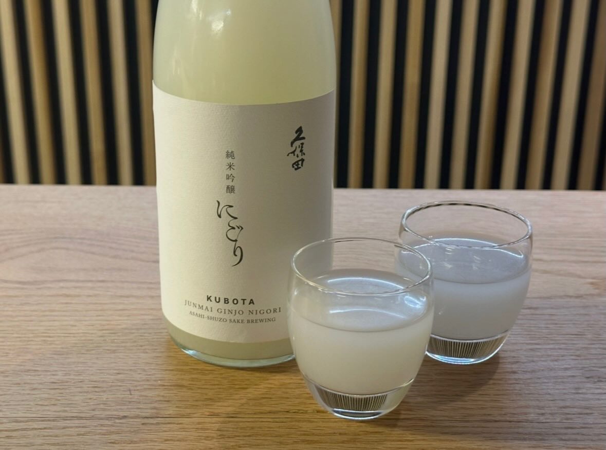 Kubota Junmai Ginjo Nigori, known for its cloudy appearance with a velvety, elegant texture.