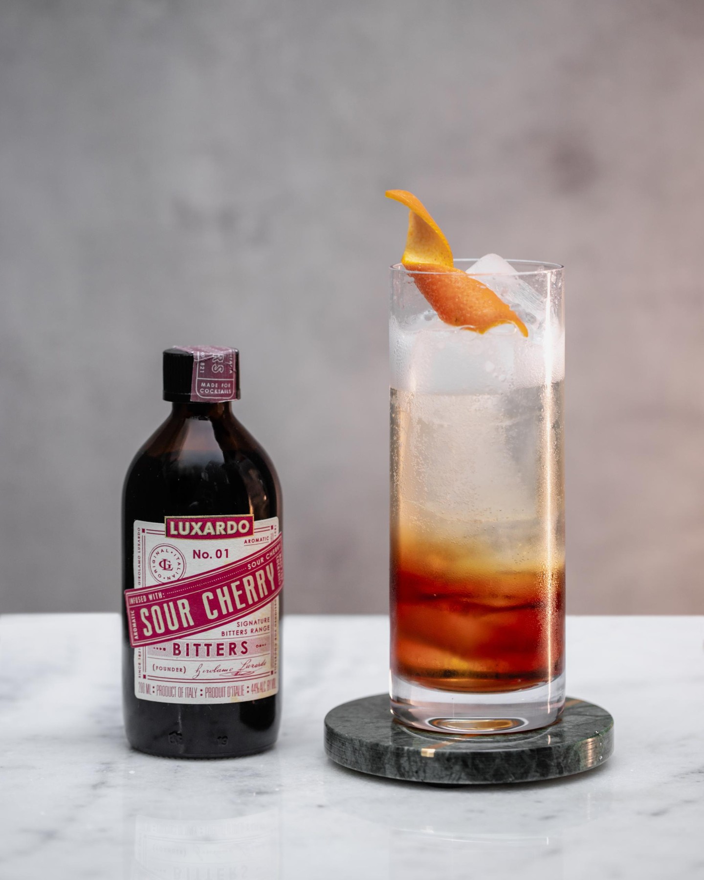 Bittersweet in the best way. Cherry Bitters Cola made with Luxardo Sour Cherry Bitters, sweet vermouth, soda water, and an orange twist. ๐ฅค๐