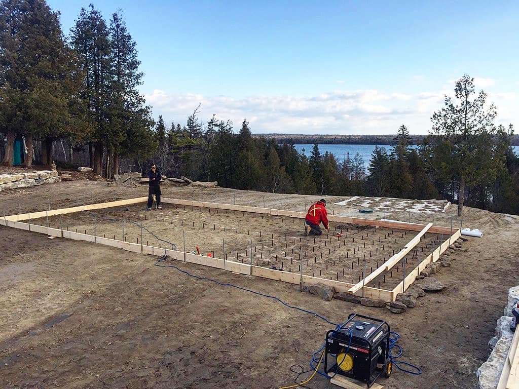 Rebar dowel installation with a view on Manitoulin Island! The foundations for this new shipping container cottage will be pinned directly to the bedrock.
Thanks for the 📸 @constantshape