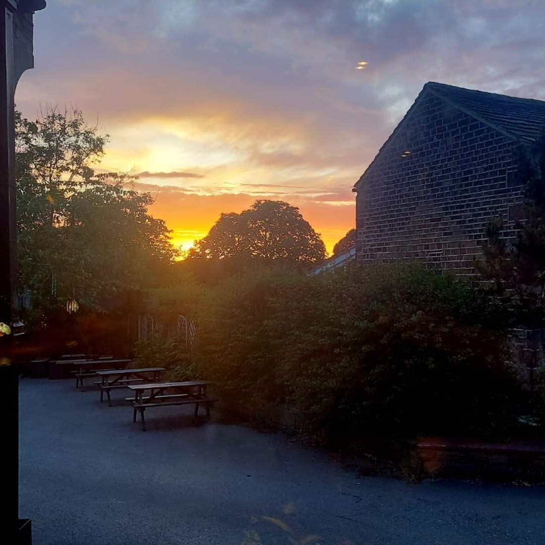 Golden sunset at the back of the Golden Cock.