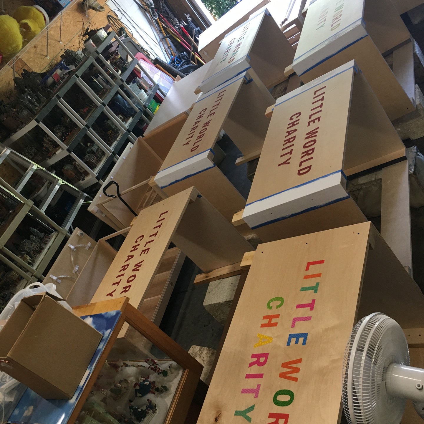 New display bases to better protect our existing displays, being lettered in Tim and Shelly Gabriel's garage.