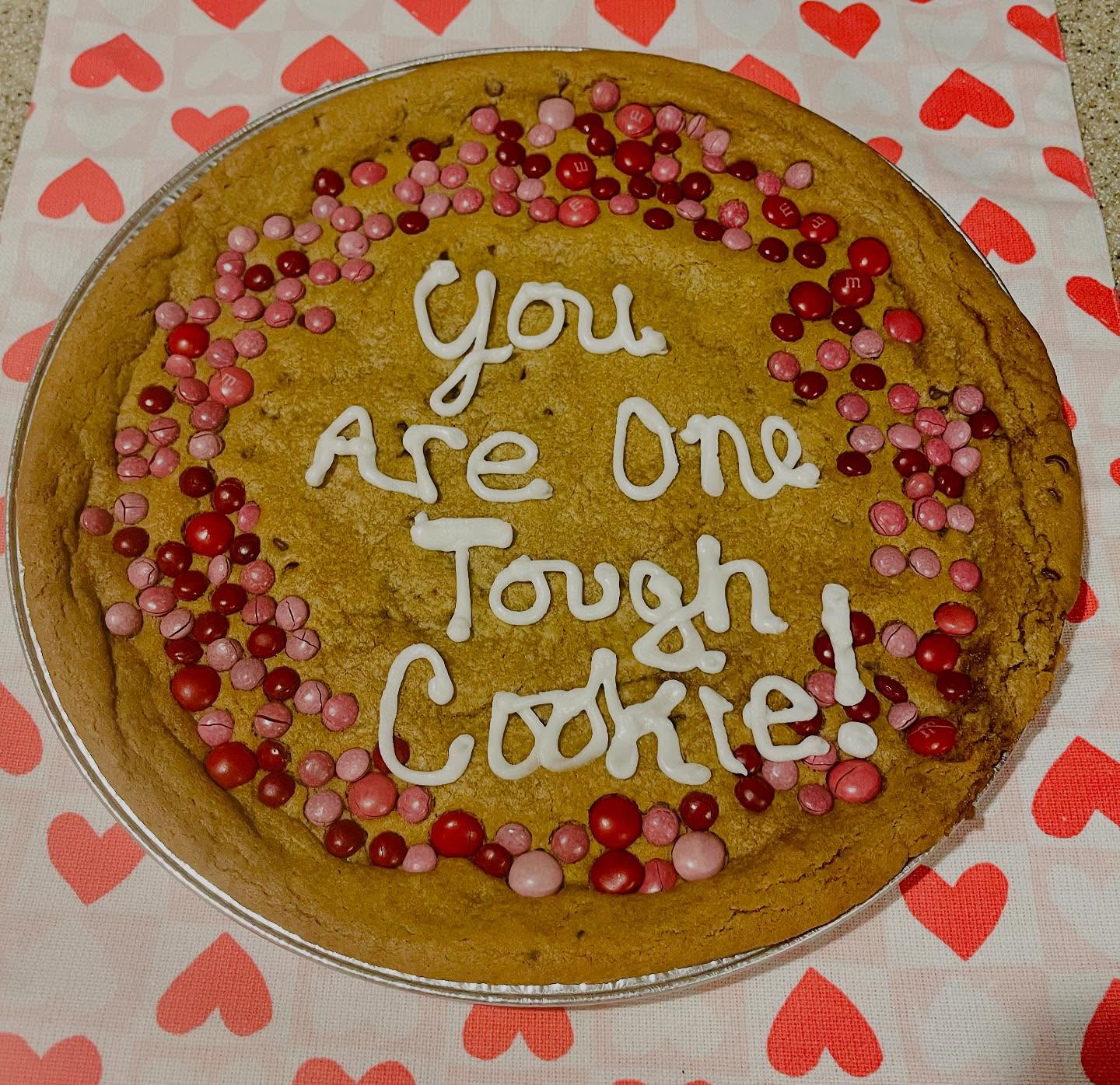 One of the most popular items we sell are our baked to order, custom cookie cakes! They come in 12 inch, 16 inch, double layer 12 inch filled with buttercream, mini 4 inch tall cookie cake and our special triple layer cookie cake! Baked in any variety that are cookies offer. Why buy a cookie cake full of artificial ingredients when you can buy a cookie cake as delicious as our cookies are!? We also do gluten free, vegan and vegan gluten free cookie cakes. Delivered to your door, and to all local colleges and SU! Order online at www.CathysCookieKitchen.com.