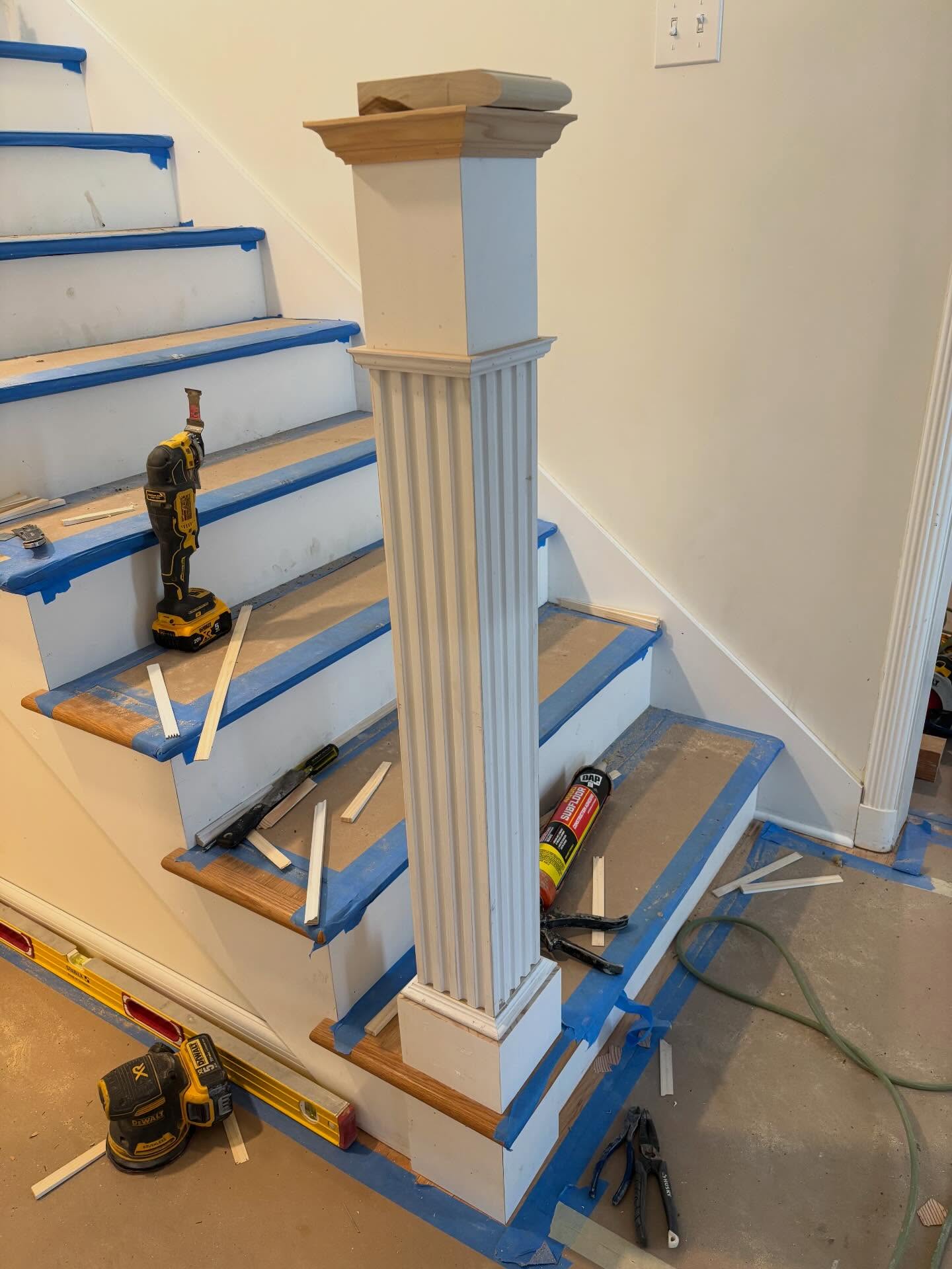 It’s in the details - newel post carrying the trim detail from the original fireplace.