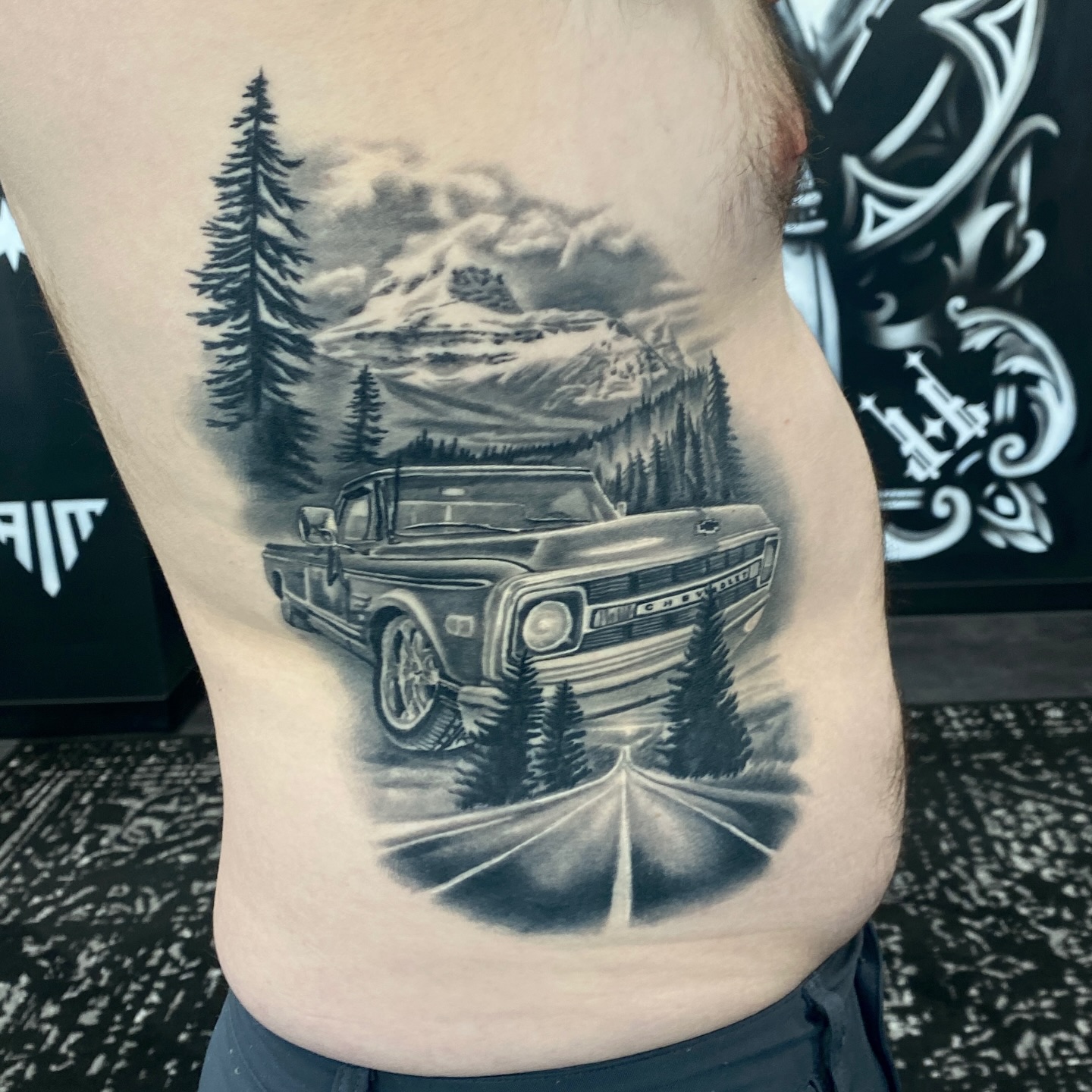 Settled in for a year! This is still a little light/mid tones based for my liking but I'm confident it will stand the test of time on this low sun-exposure area. I'm always trying to bring more black and more negative space to my pieces. My tendency is to get lost in the details and put in "accurate" values and it is a constant push for me to use more black, more dark and more open space! The point I'm making is that while I am super proud of this soft realistic piece, I would make it very different if I were tattooing it today. Always learning, always pushing for the next step to make tomorrow's tattoo simpler, cleaner and more resilient to the test of time!
.
Thanks for looking!
.
Follow @scottie.tattooer
And @fortunesfavourtattoo
.
#squarebody #squarebodychevy #classictrucks #realismtattooing #farmtruck