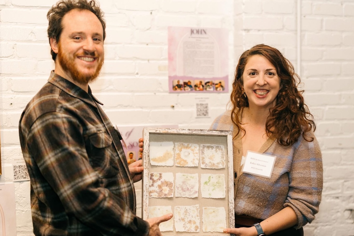 Congratulations to the Silberstein-Mlaver Family ❤️ #POTAArtAuction Somerville Toddlers: John
To create our piece for the annual art auction, the Somerville Toddlers combined two things they love most: construction and beautiful flowers that remind us of springtime.
We began by observing the flowers as a bouquet and then individually, noticing their shapes, colors, and details. Next, each friend smelled the flowers, compared their scents, and chose a favorite.
After our sensory exploration, friends used mallets to press the flowers onto watercolor paper. As they tapped and banged the mallets, they proudly pretended to be construction workers hard at work helping their community. One friend even shared that they were helping to “make outside beautiful.” As the flowers were pressed into the paper, friends noticed how the colors from the petals and stems transferred onto the page.
Once each friend completed their print, our Morahs brought all of the individual pieces together to create a patchwork of flowers, representing a quilt. Just as every square of a patchwork quilt tells a story, each flower-print square captures the story of a toddler exploring spring, nature, and creativity.
When our final project was complete, our friends gathered together to admire each flower print joined as one beautiful art piece. It was then time to choose a name for our work. When a Morah asked, “What should we name this picture?” one friend enthusiastically shouted, “John!” This sparked a burst of giggles across the classroom, and soon several friends joyfully echoed the name with big smiles.
The Somerville Toddlers are proud to present their 2026 Art Auction piece: John.