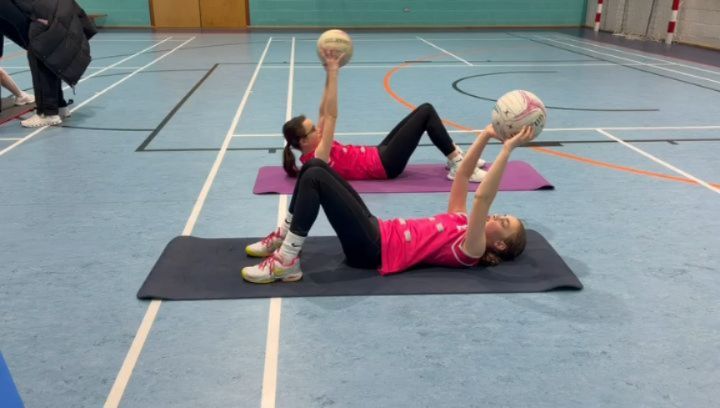 Working 💪 on that core! Crunches, leg lifts and ukranian twists! Our amazing teams working so hard. #workhard💪 #macclesfield #netball #teamwork