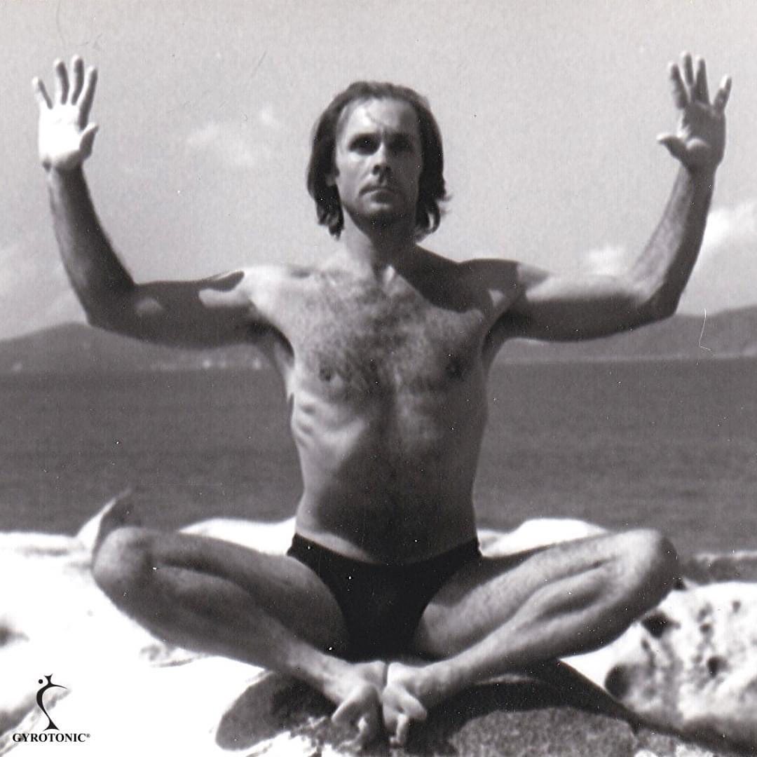 Circa 1977. This is a photo of Juliu Horvarth, the creator of the GYROKINESIS® method on the island of St. Thomas in the Virgin Islands, where he immersed himself in movement and meditation and conceived his unique exercise method.
_
Juliu was born in 1942 in Romania. He always had a love of movement and excelled at swimming, rowing and gymnastics. He started dance late at 19, and by the age of 21, he was the principal dancer for the Romanian National Ballet Company. Whilst on tour in Italy in 1970, he defected from Romania, living in a refugee camp for six months before receiving political asylum in the United States. He then moved to New York and did whatever jobs he could do to survive. He eventually secured a position as principal dancer with the Houston Ballet.
_
Whilst at the Houston Ballet, he ruptured his Achilles tendon bringing his dance career to a sudden halt. He returned to New York and began regular yoga practice, and as he got deeper into his movement and meditation practices, he began having more profound energetic experiences. In 1977, he moved to St. Thomas in the Virgin Islands, and built a small one room hut in the mountains and spent the next six years studying yoga and meditation. He gained new insights into movement and healing and began to create his own unique exercise method.
_
In the 1980’s he started teaching his new movement system called ‘Yoga for Dancers’ in New York. As his clientele became more diverse, he refined his work so that any person regardless of age and health could participate in classes. He called this the GYROKINESIS® method. The original ‘Yoga for Dancers’ movements are still taught as part of the Level 2 program.
_
Juliu continues to refine the method, last year introducing a new ‘Cardiovascular Breathing Program’ online over 21 days, which I was grateful to be a part of. There are 13,000 Trainers in 80+ countries now teaching his work. At the moment, I am the only certified GYROKINESIS® exercise teacher on the Sunshine Coast. I started my GYROKINESIS® journey in 2013 and finally got certified in 2016. I continue to grow and learn from my experiences.